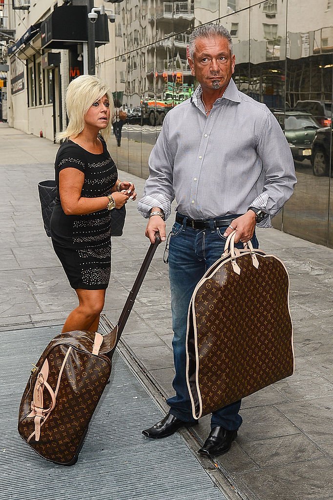 Theresa Caputo (L) and Larry Caputo leave the "Good Day New York" taping at the Fox 5 Studios on September 6, 2012. | Source: Getty Images