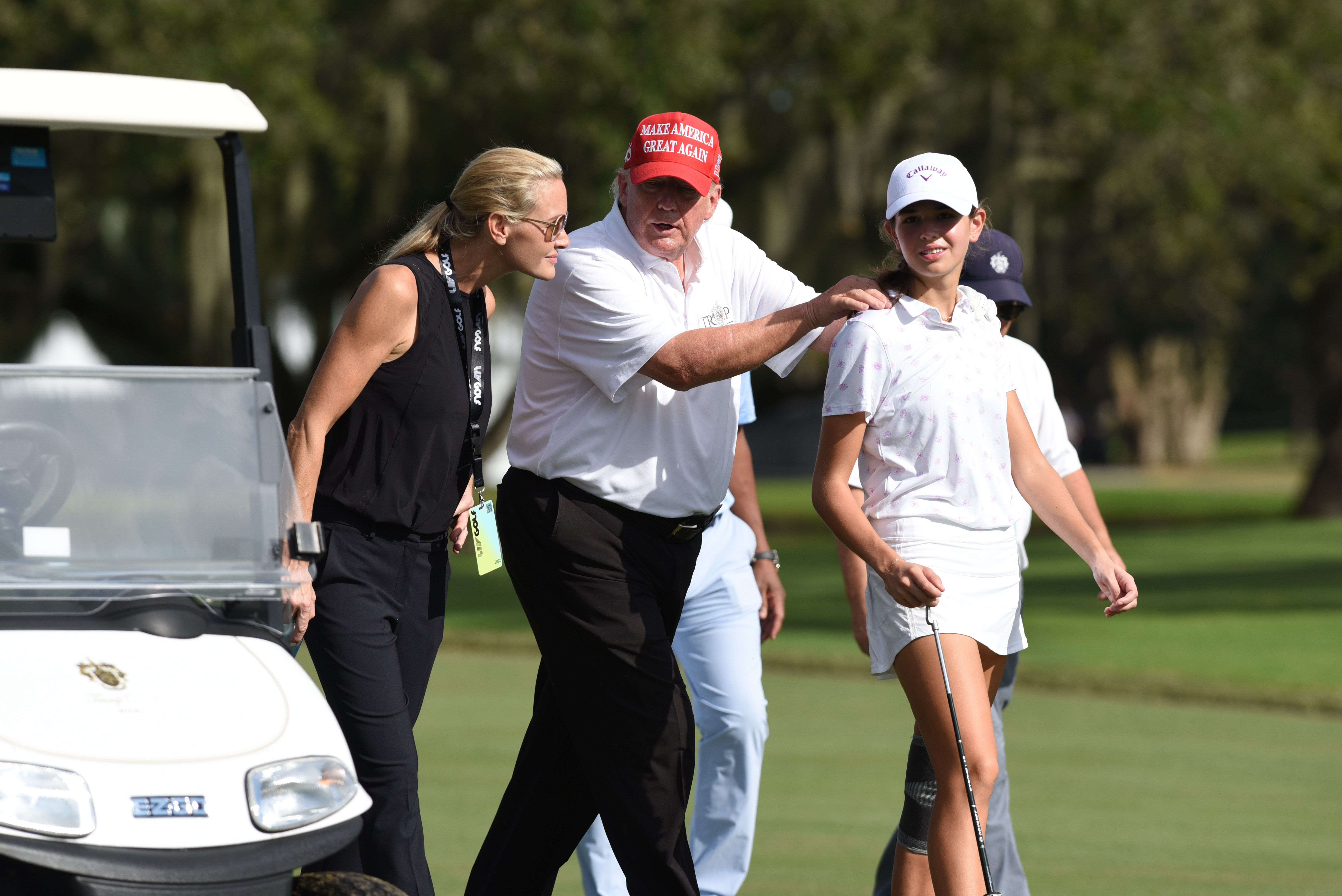 President Donald Trump, center walks with his niece Kai Trump and her mom Vanessa Trump during the ProAm ahead of the LIV Golf Team Championship, on October. 27, 2022, at Trump National Doral Golf Club in Doral, Florida | Source: Getty Images