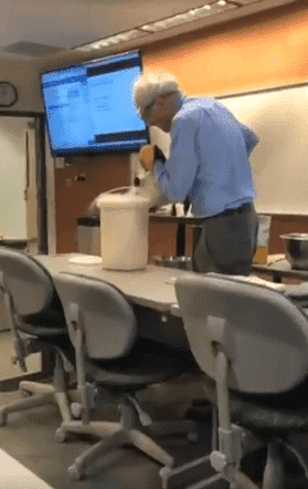 Professor, David Wright, teaching his students Physics by demonstrating his lessons | Photo: Twitter/@it'sErica