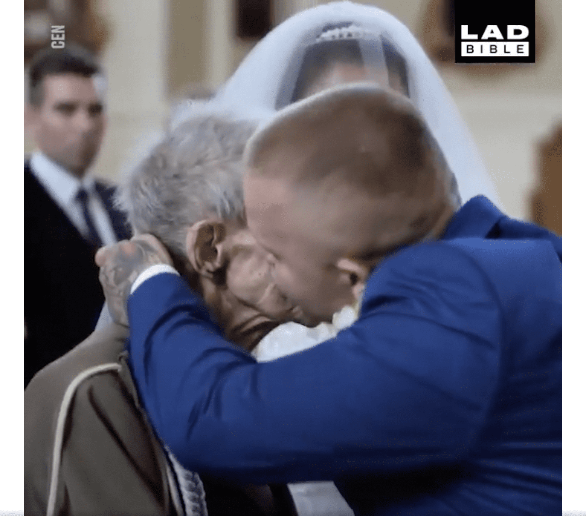 The groom kisses Bronislaw "Grom" Karwowski. | Source: facebook.com/LADbible