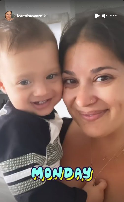 A selfie shot of Loren Brovarnik holding her son Shai smiling | Source: Instagram/@lorenbrovarnik