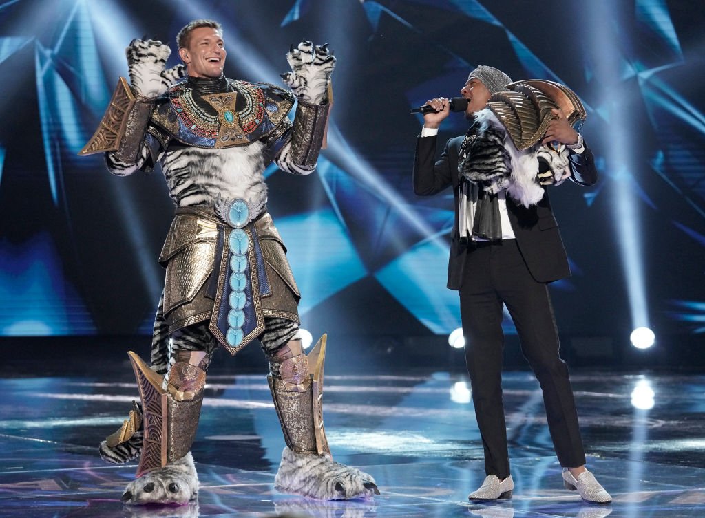 Host Nick Cannon and Rob Gronkowski in The Super Nine Masked Singer Special: Groups A, B & C special two-hour episode of THE MASKED SINGER airing Wednesday, April 1 | Photo: Getty Images