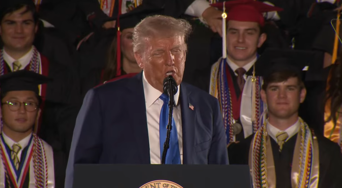 Donald Trump remarks that Melania Trump disapproves of such impressions while addressing the graduating class in Tuscaloosa | Source: YouTube/WhiteHouse