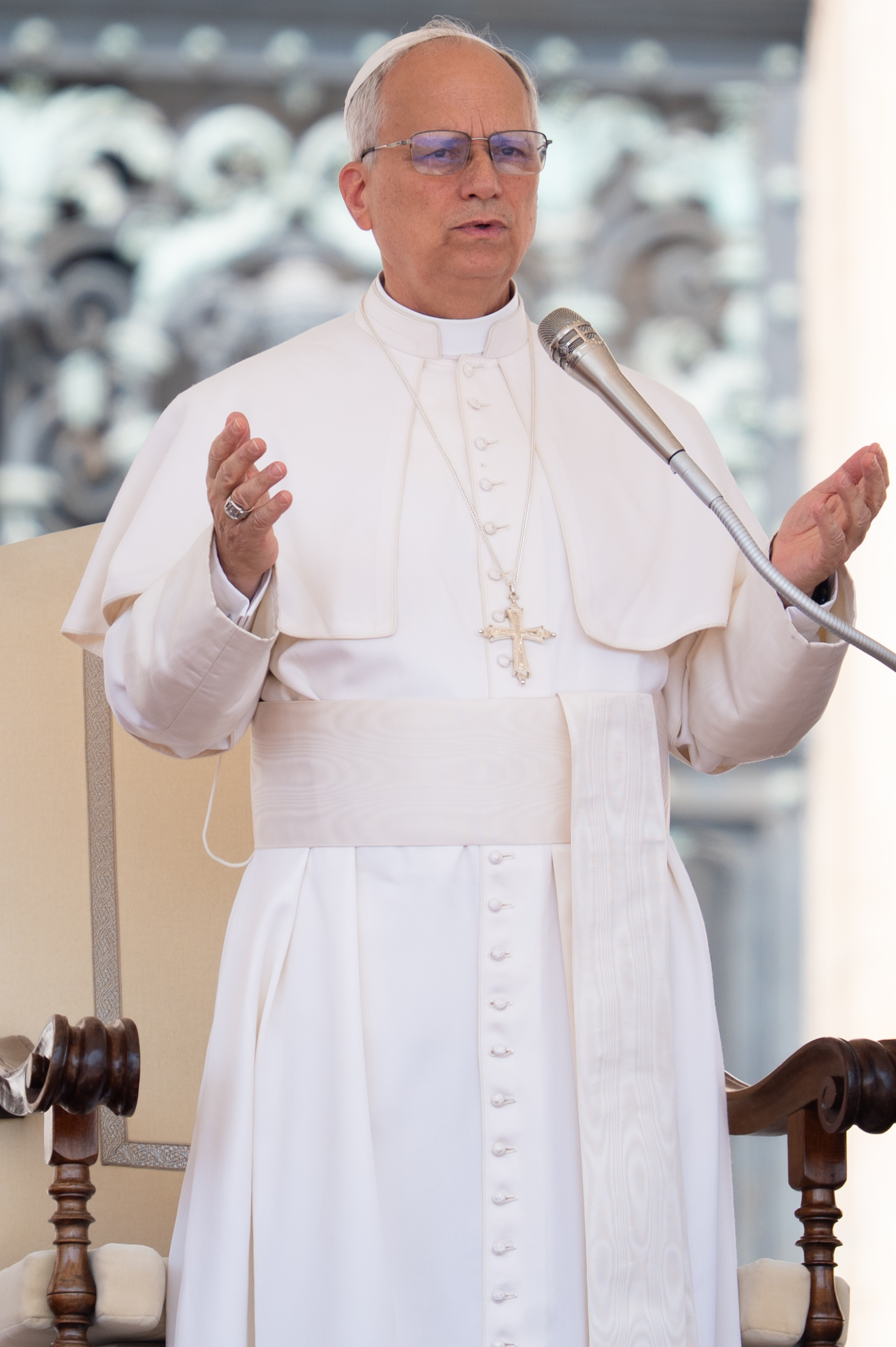 With both hands raised, Pope Leo XIV delivers his message during the weekly general audience at St. Peter's Square in Vatican City on June 11, 2025 | Source: Getty Images