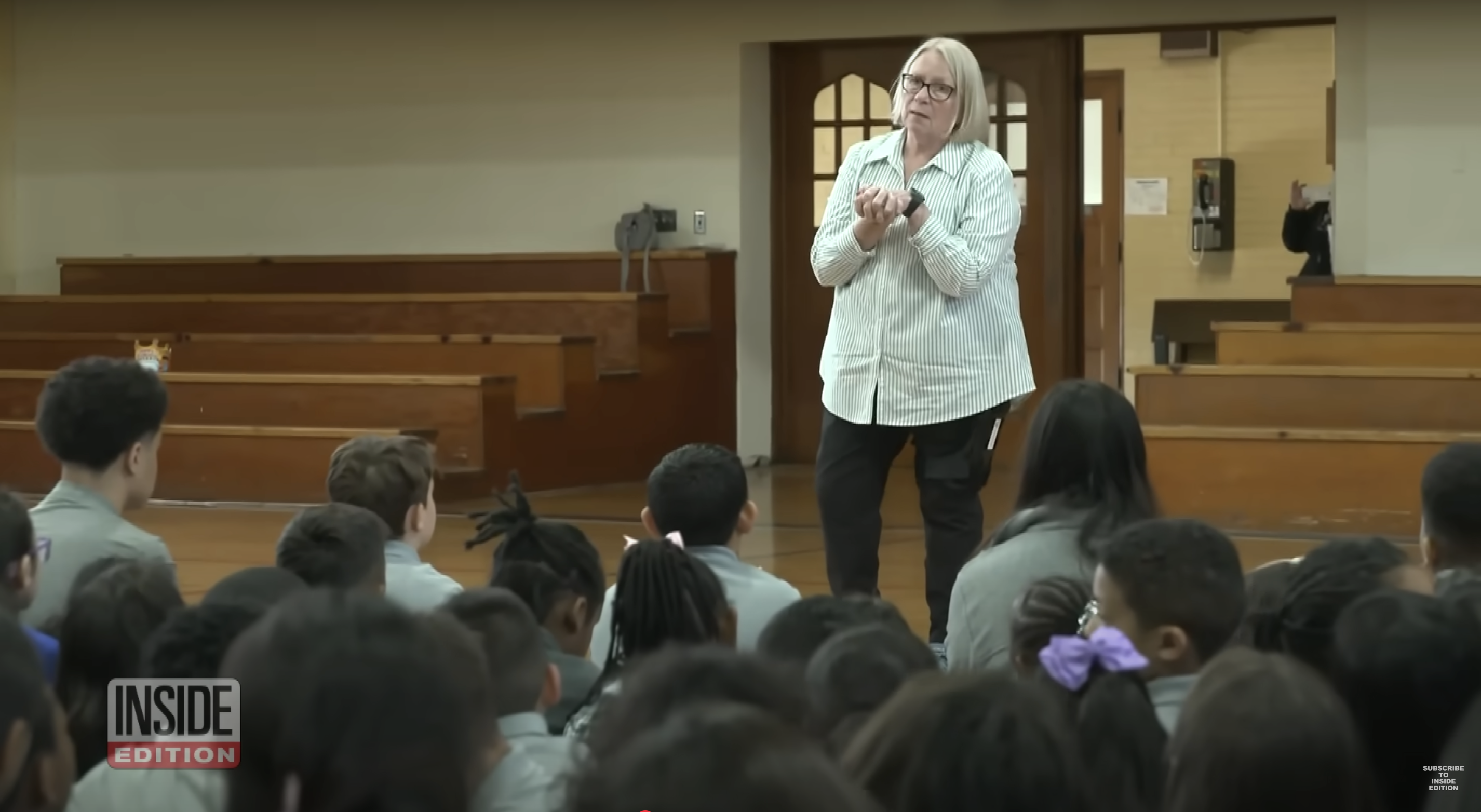 Pope Leo XIV's former classmate, Nicole Niece, is pictured talking to young students in a video dated May 10, 2025 | Source: YouTube/InsideEdition