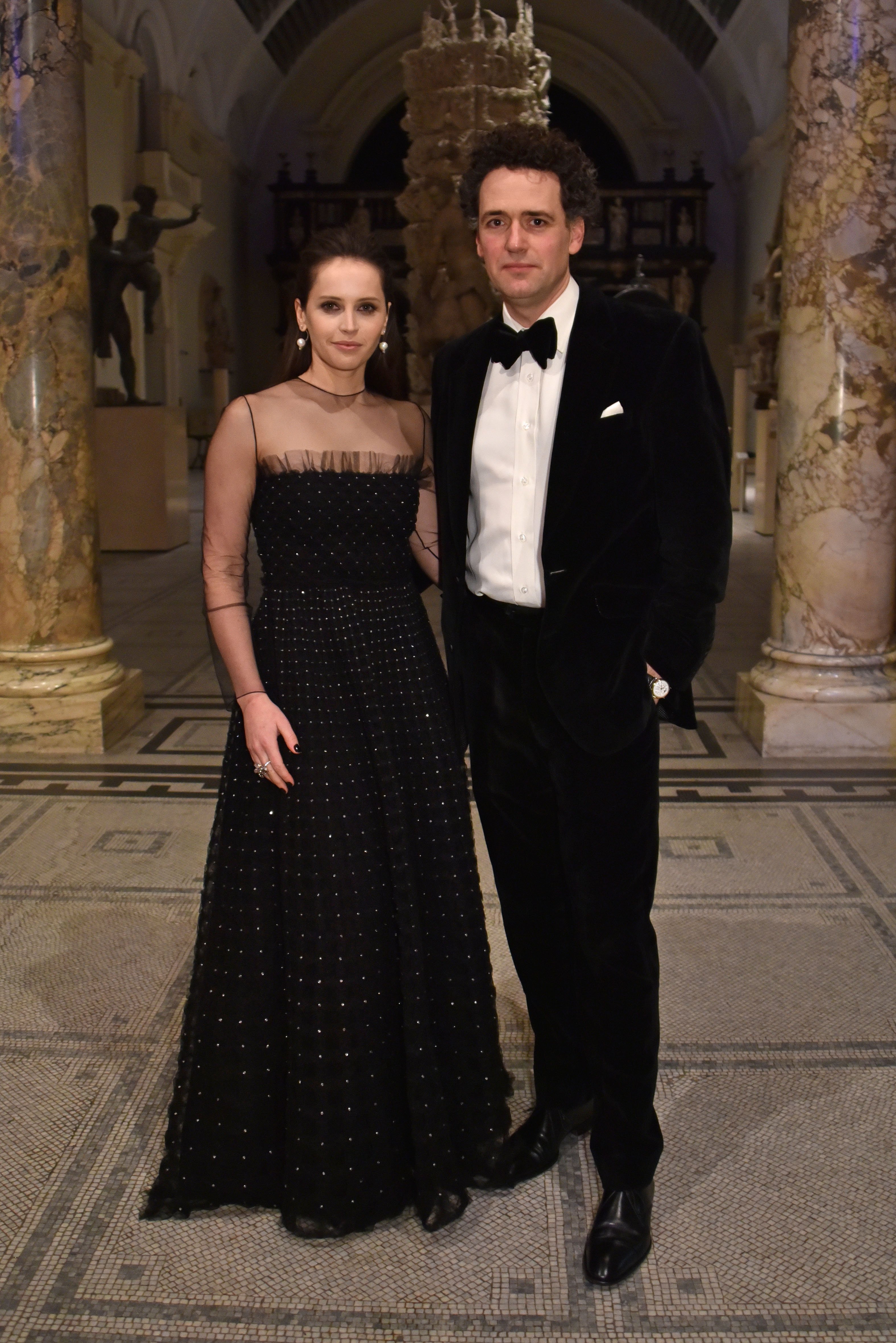 Felicity Jones and Charles Guard at the opening of the "Christian Dior: Designer of Dreams" exhibition on January 29, 2019, in London, England. | Source: Getty Images