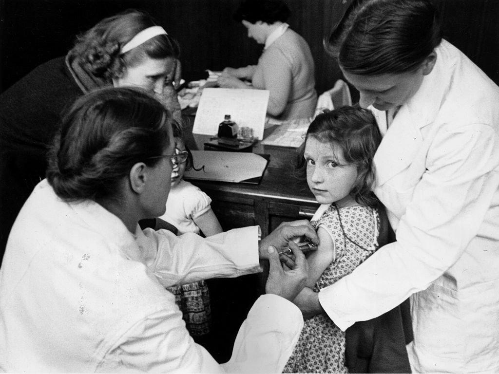 A child is injected with a vaccine against paralytic poliomyelitis, 1956 | Source: Getty Images