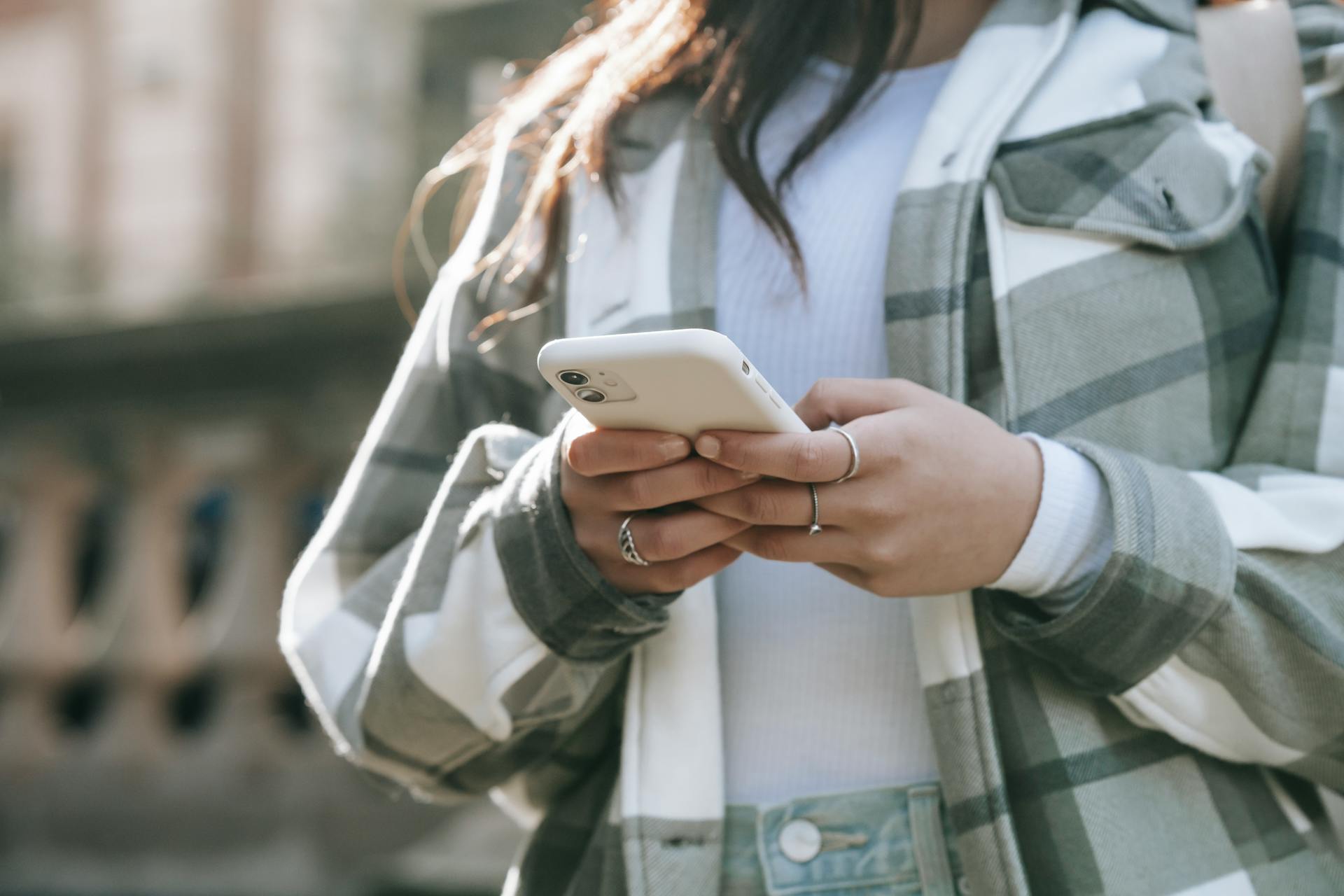 A close-up shot of a woman using her phone outside | Source: Pexels