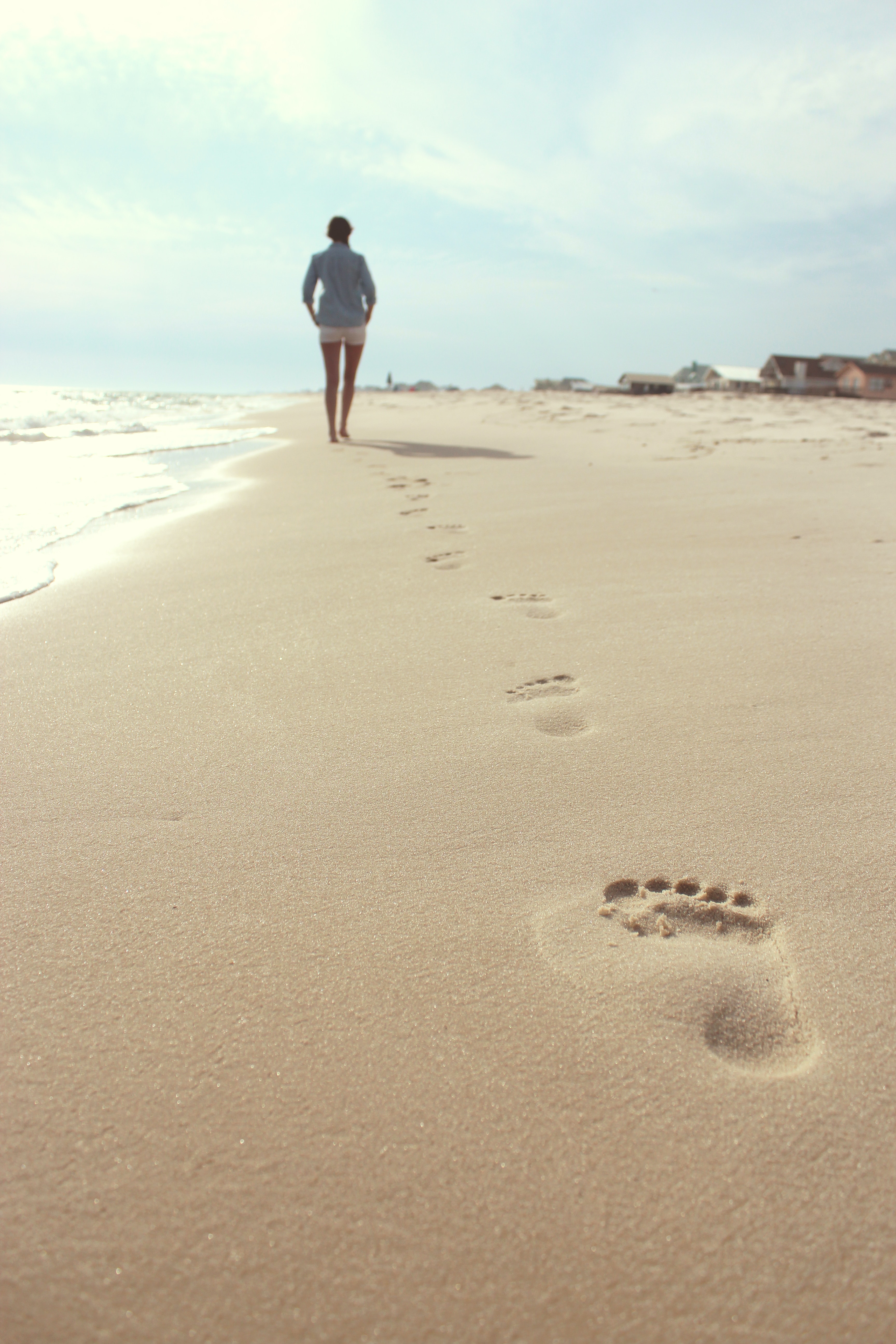 A woman walking on the beach. | Source: Unsplash
