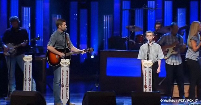 Josh Turner performs next to young musician with autism in a touching duet