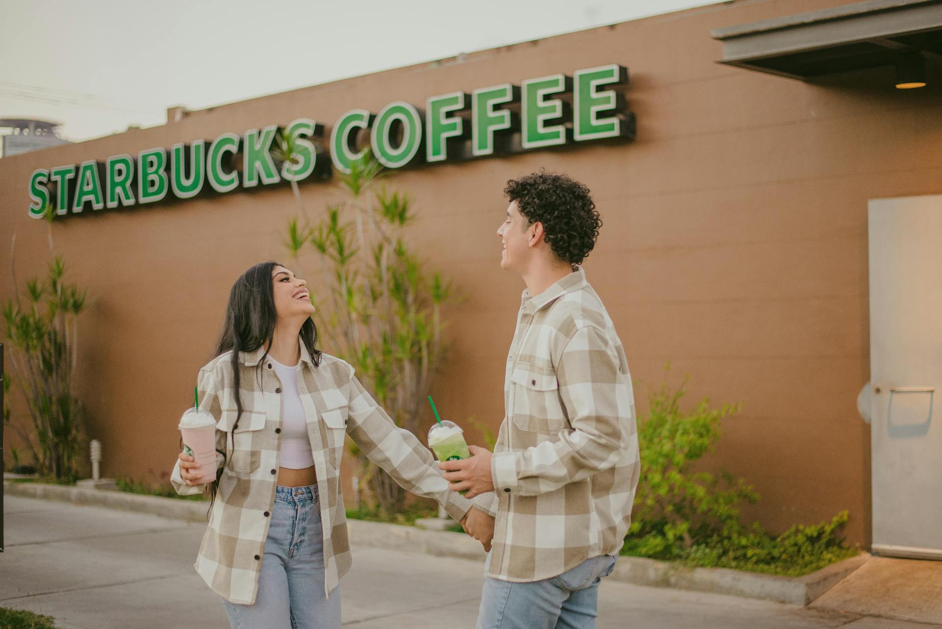 A couple enjoying at Starbucks | Source: Pexels