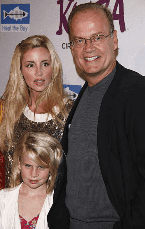 Kelsey Grammer, his wife Camille Grammer and their daughter Mason Olivia Grammer arrive on the read carpet for the Cirque Du Soleil Opening Night Gala, on October 16, 2009 in Santa Monica, California | Source: Getty Images (Photo by Jean Baptiste Lacroix/WireImage)