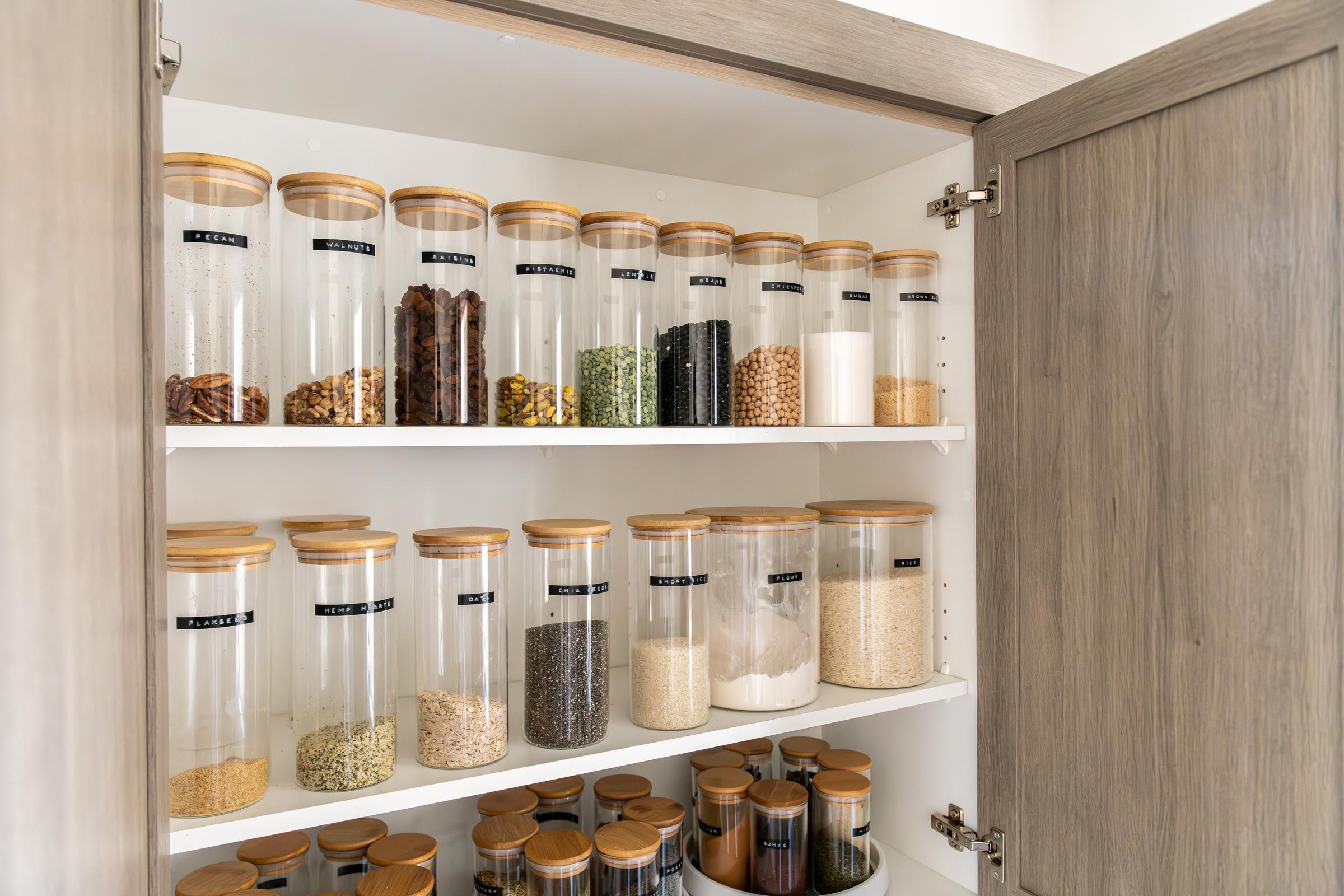 A neatly organized and labeled food pantry | Source: Shutterstock