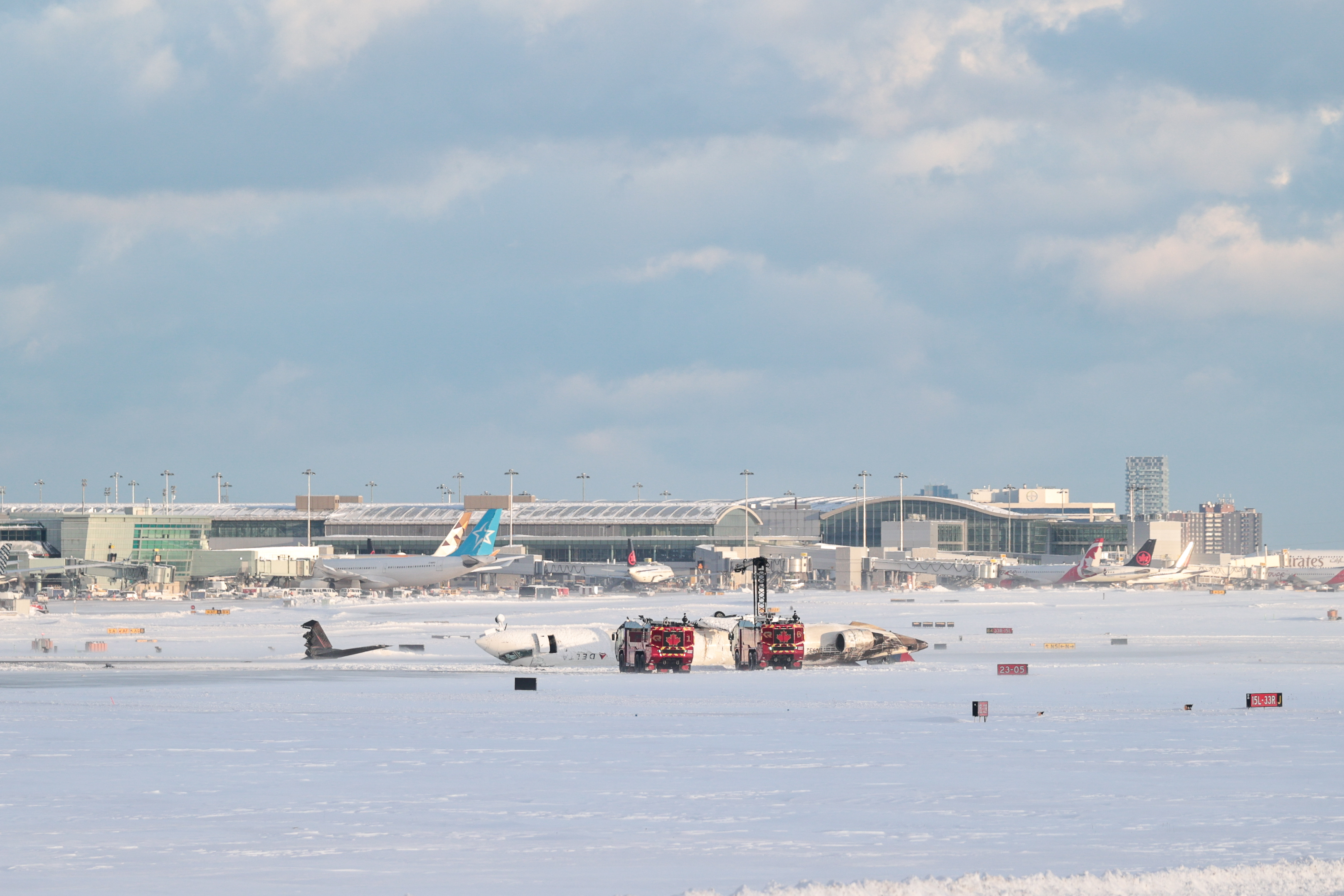 DELTA flight 4819 from Minneapolis is seen overturned on the runway after crashing while landing at Pearson International Airport in Toronto, Canada on February 17, 2025 | Source: Getty Images