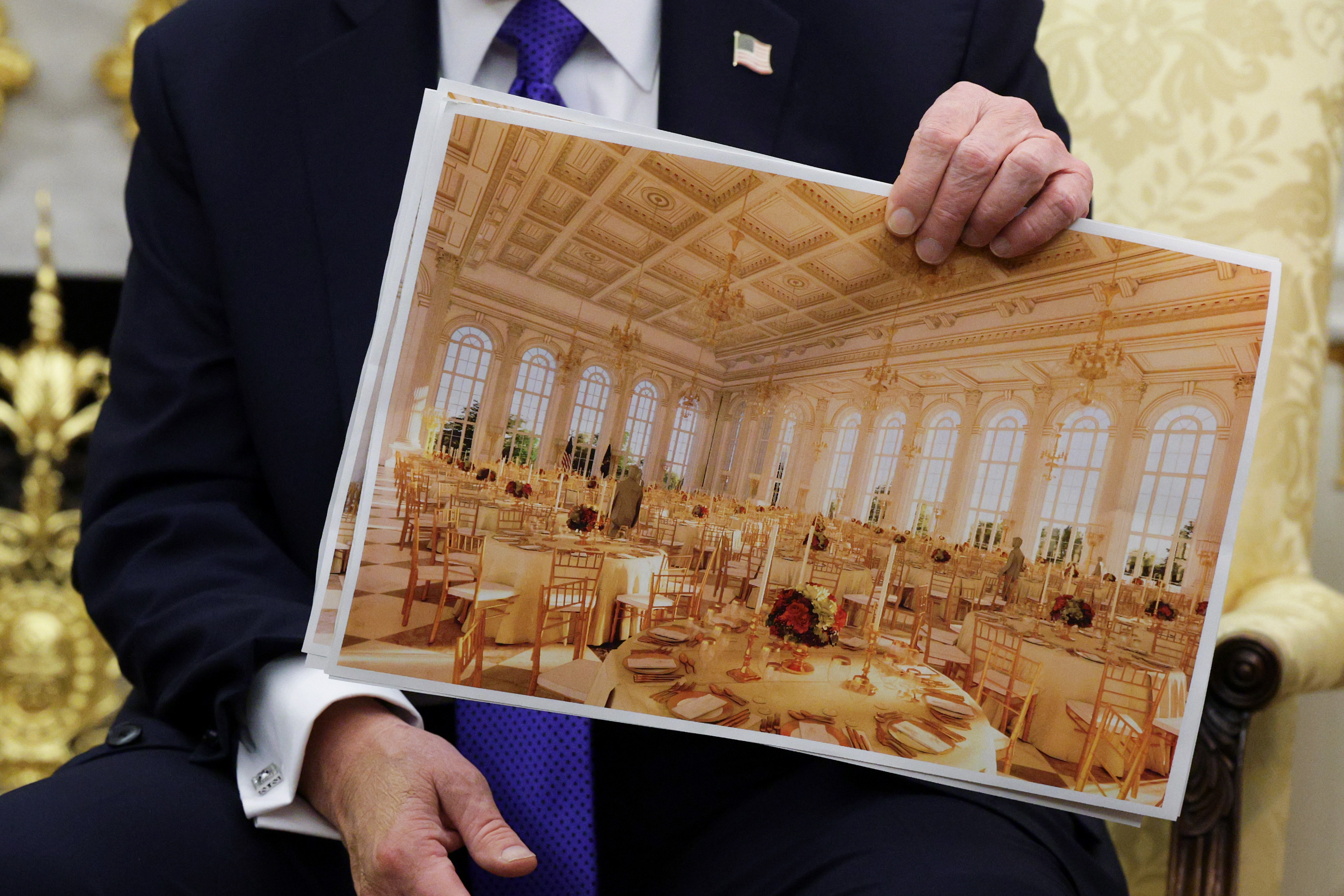 President Donald Trump displays a rendering of his proposed $250 million White House ballroom on October 22, 2025, in Washington, DC. | Source: Getty Images