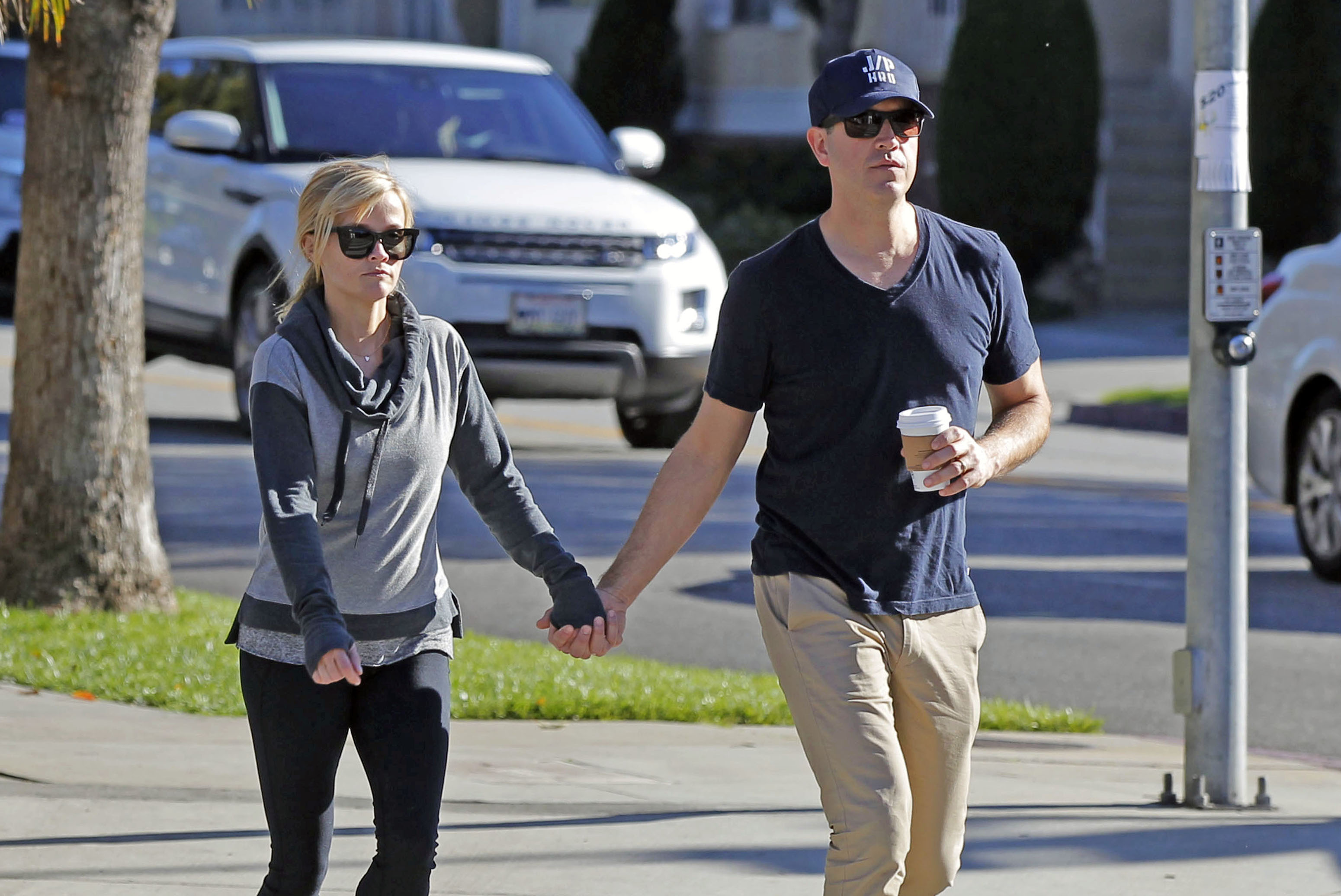 Witherspoon and Toth are spotted holding hands during a casual outing on February 13, 2015, in Los Angeles, California. Dressed down and relaxed, Toth carries a coffee in his free hand as the pair enjoy what looks like a typical day out together.