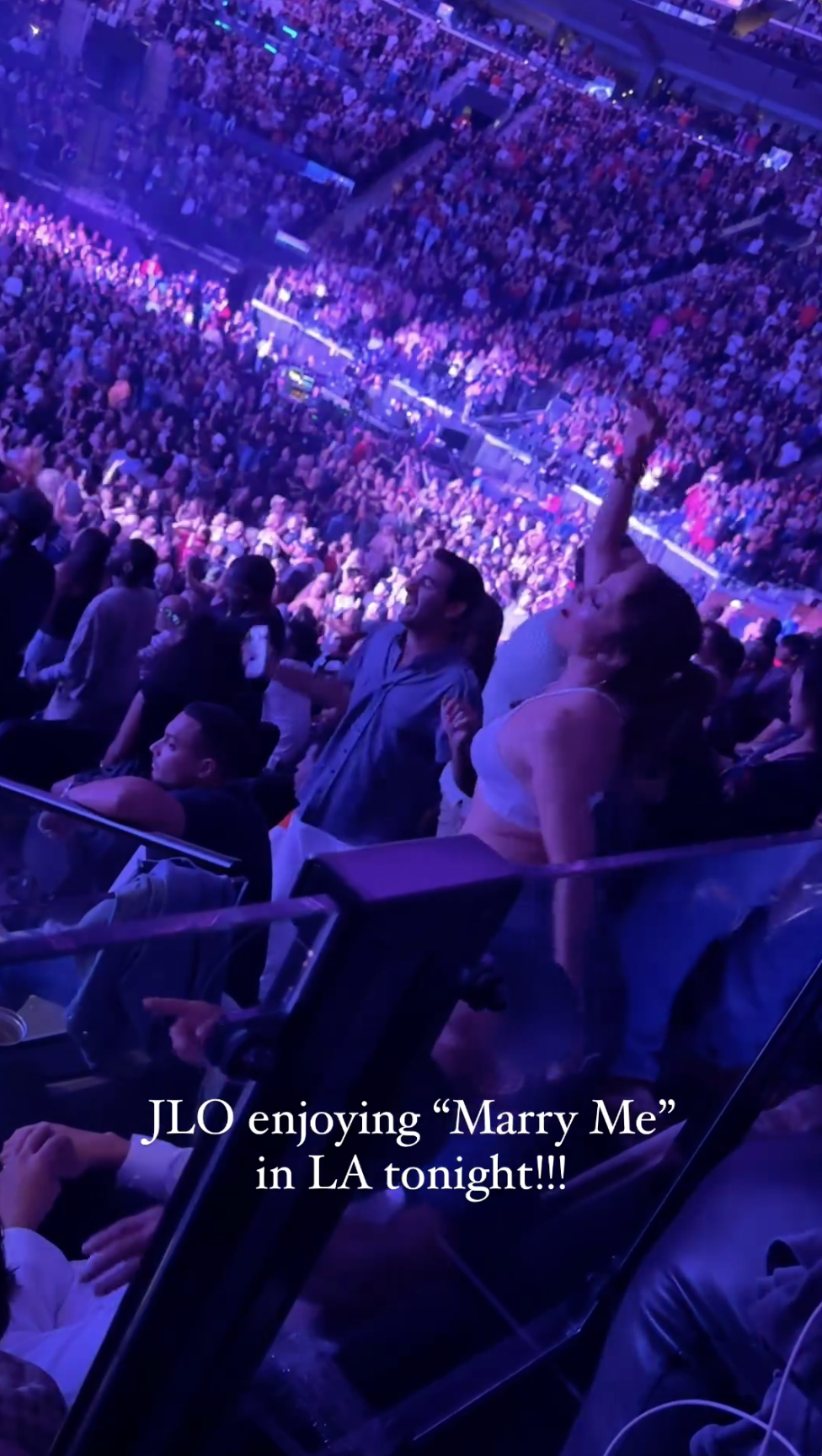 Jennifer Lopez dances with her hand up to the song "Marry You" at Bruno Mars's concert in Los Angeles, California, posted in August 2024 | Source: Instagram/itstetrisbish