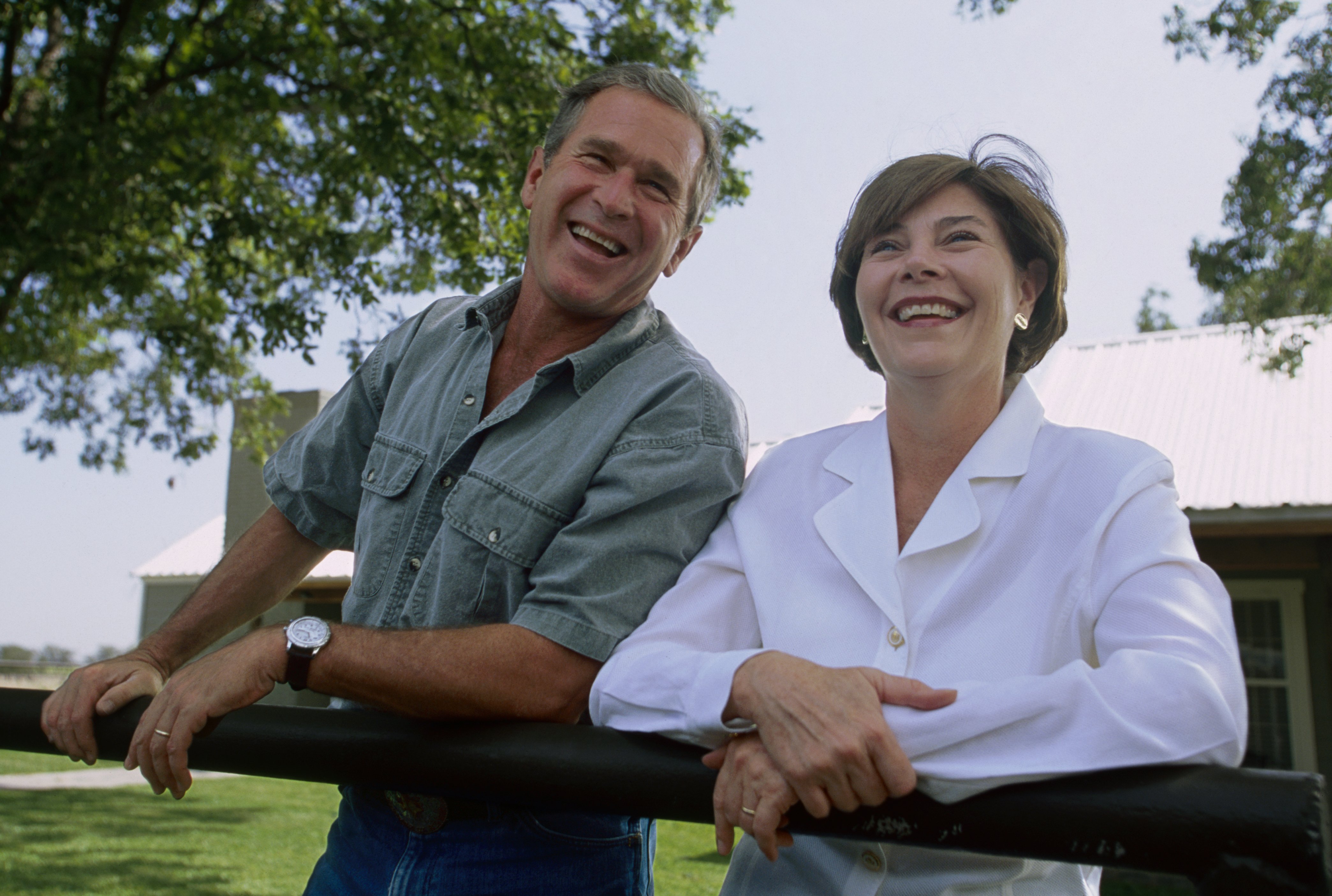 George W. Bush and his wife Laura stand outside their Texas ranch while awaiting the results of the 2000 Presidential Election recount. December 14, 2000 | Source: Getty Images 