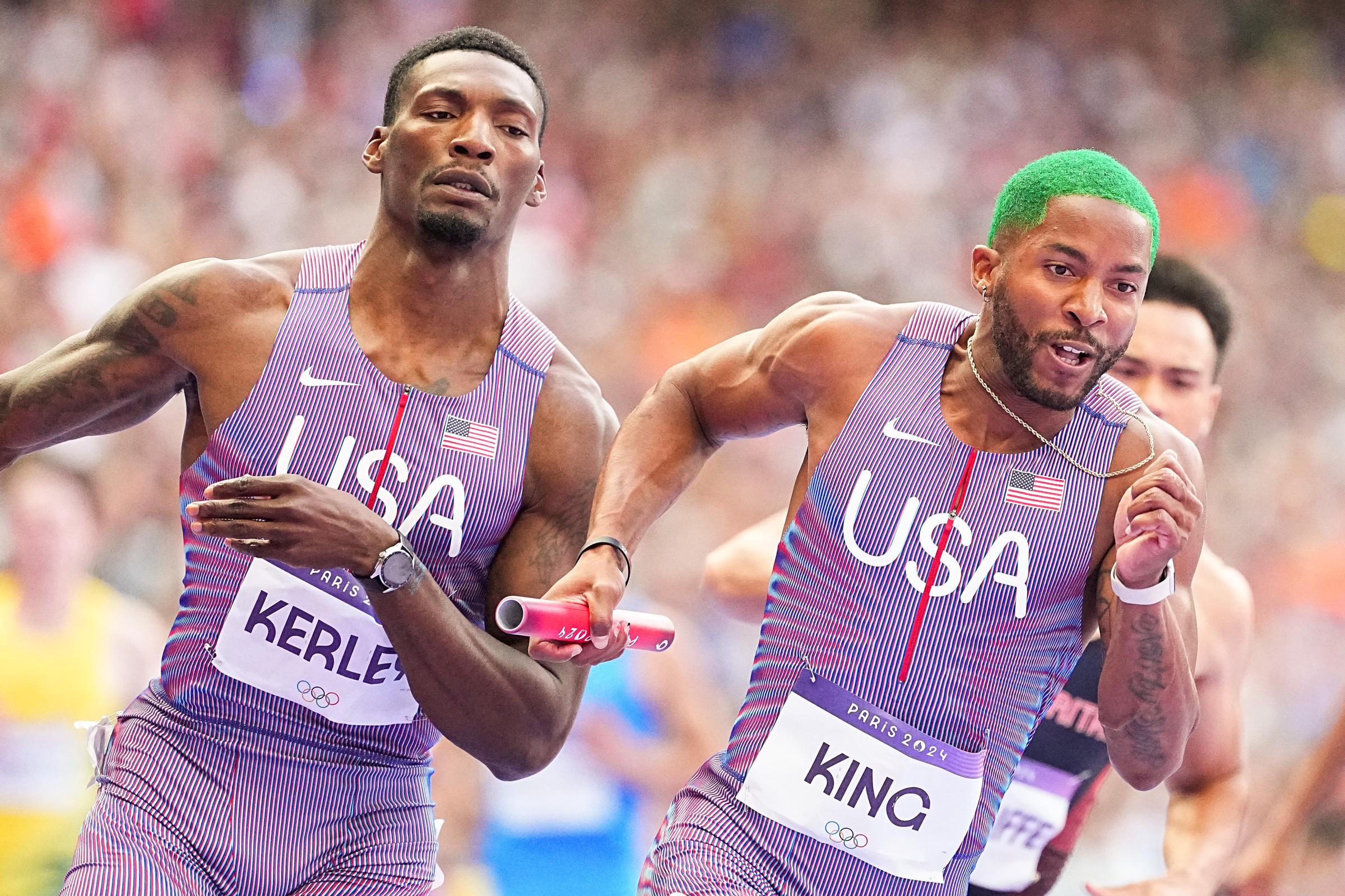 Kyree King and Fred Kerley of Team United States competing in the Men's 4x100-meter preliminary heats at the Stade de France on August 8, 2024, in France. | Source: Getty Images