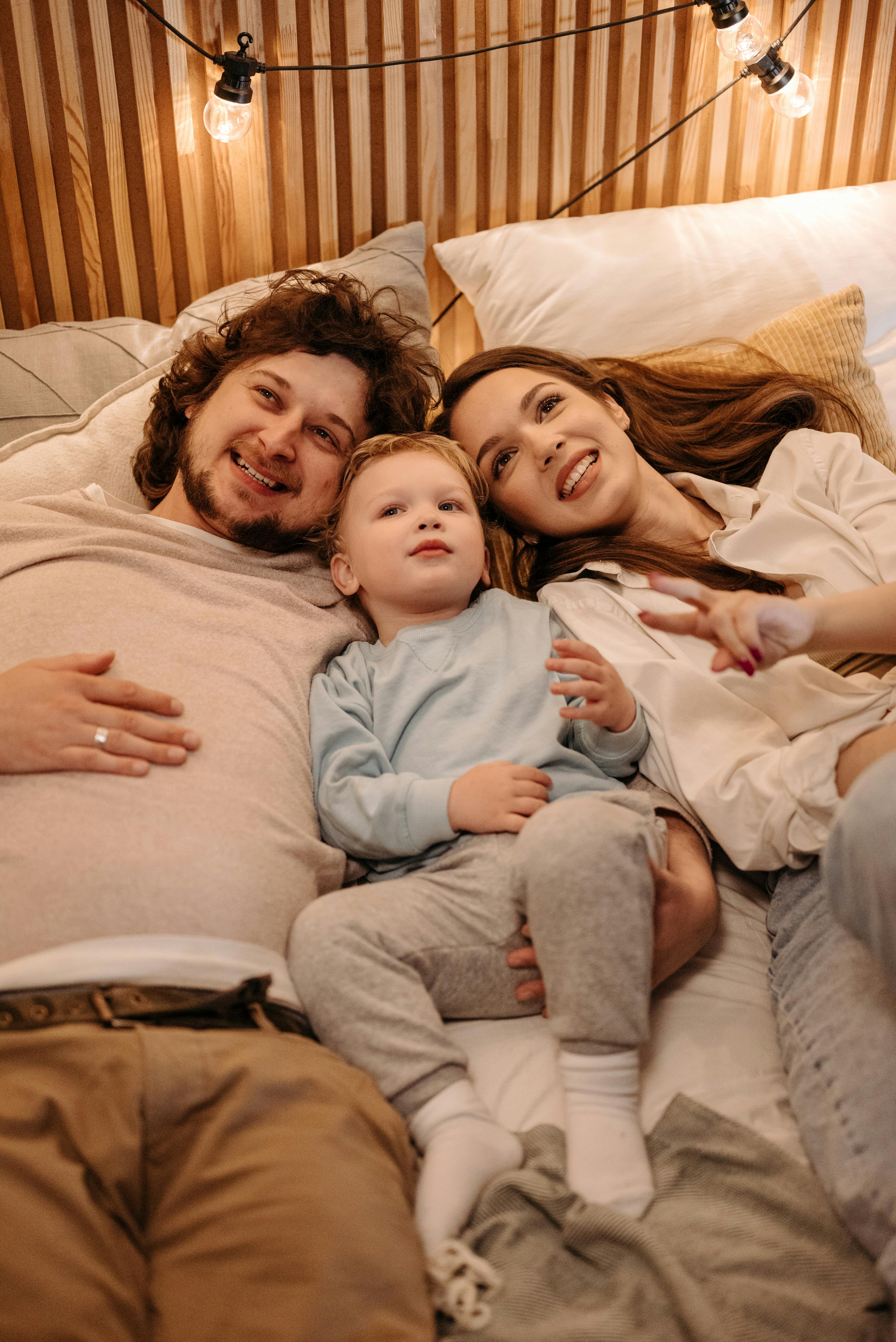 A couple bonding with their son | Source: Pexels