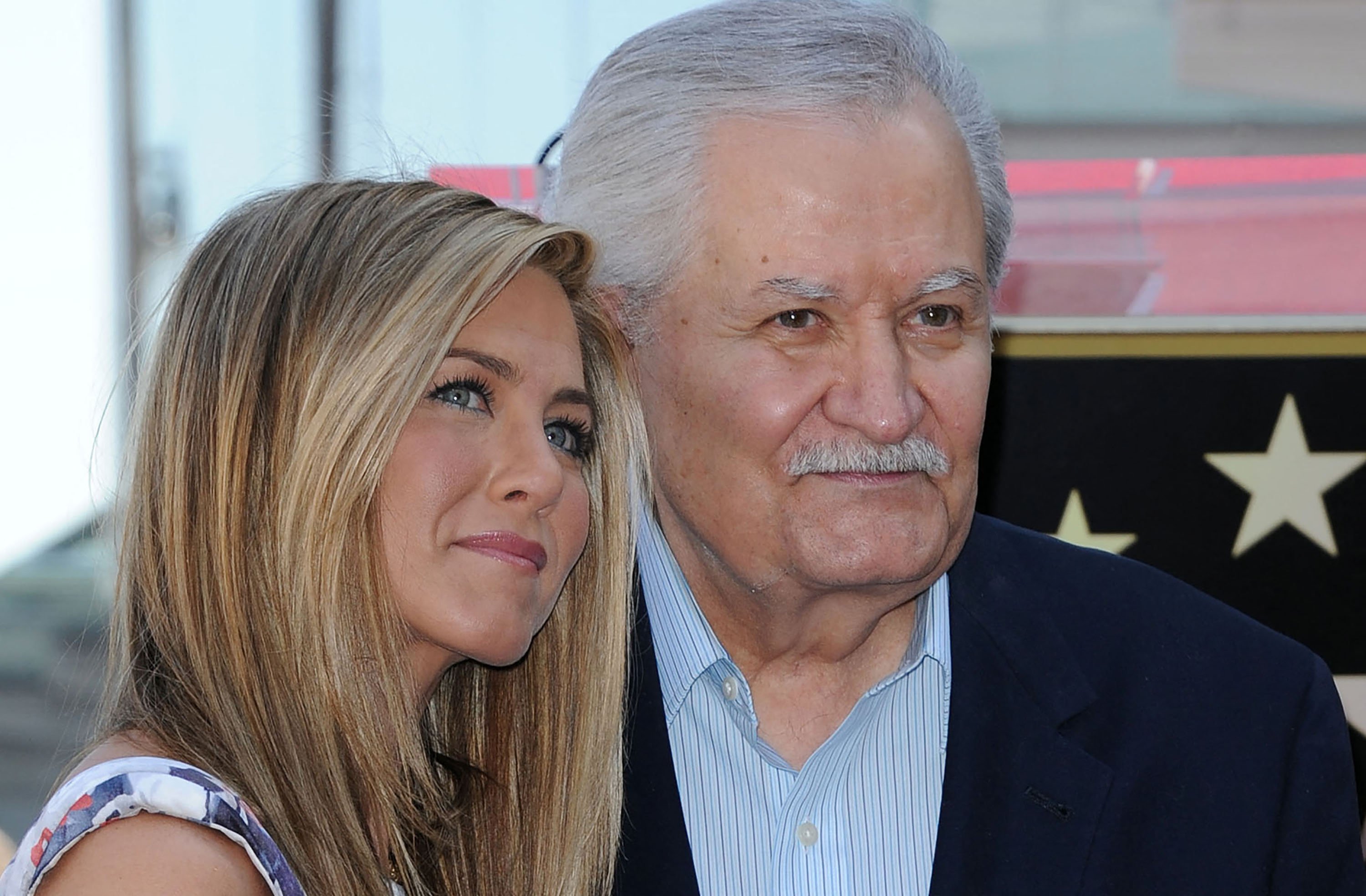 Jennifer and John Aniston during her Hollywood Walk of Fame star ceremony in Hollywood, California, on February 22, 2012 | Source: Getty Images