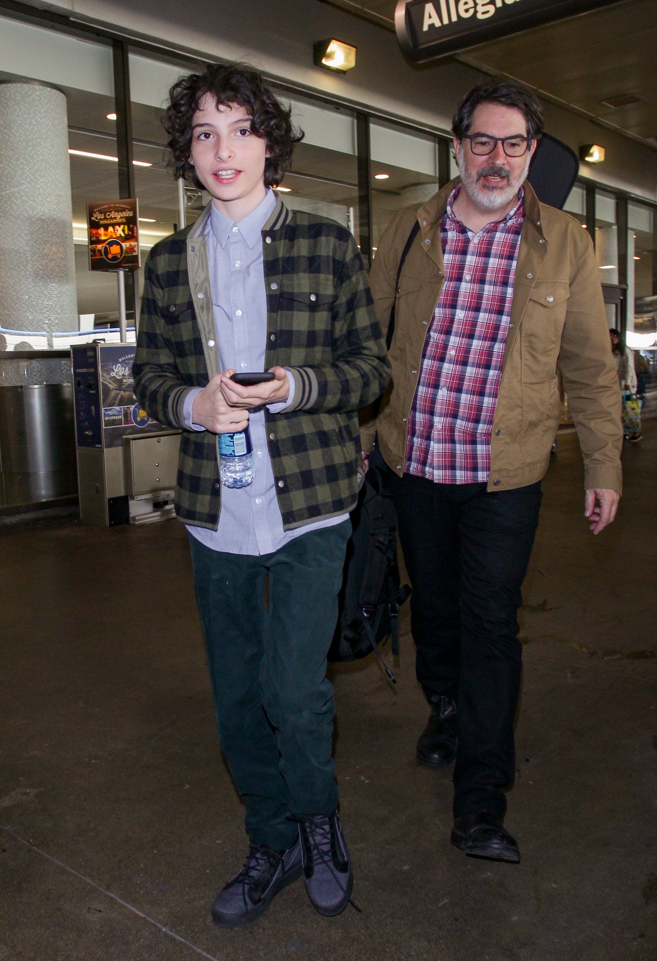 Finn Wolfhard and his father, Eric Wolfhard sighted on November 3, 2017, in Los Angeles, California. | Source: Getty Images