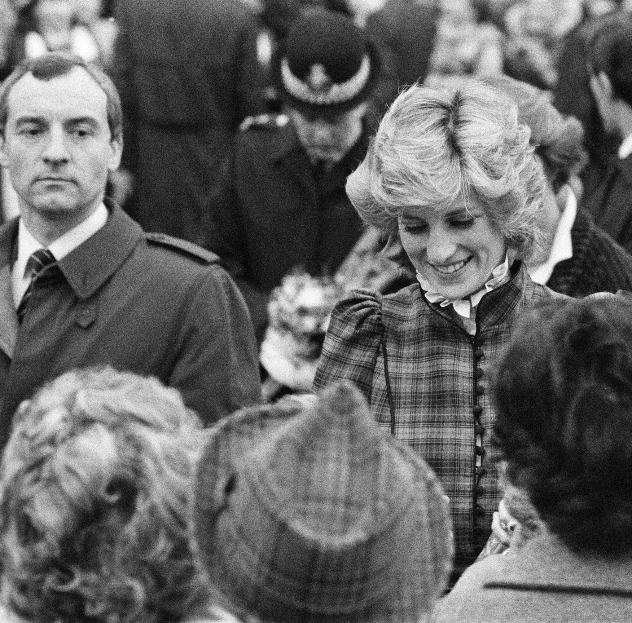 Princess Diana and behind her, her bodyguard Barry Mannakee at Mid Glamorgan in Wales. | Source: Getty Images
