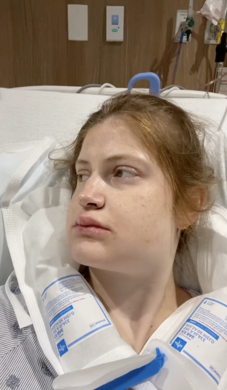 Swollen and exhausted, Virginia Elder lies in recovery shortly after her double jaw surgery. | Source: TikTok/virginiaeelder