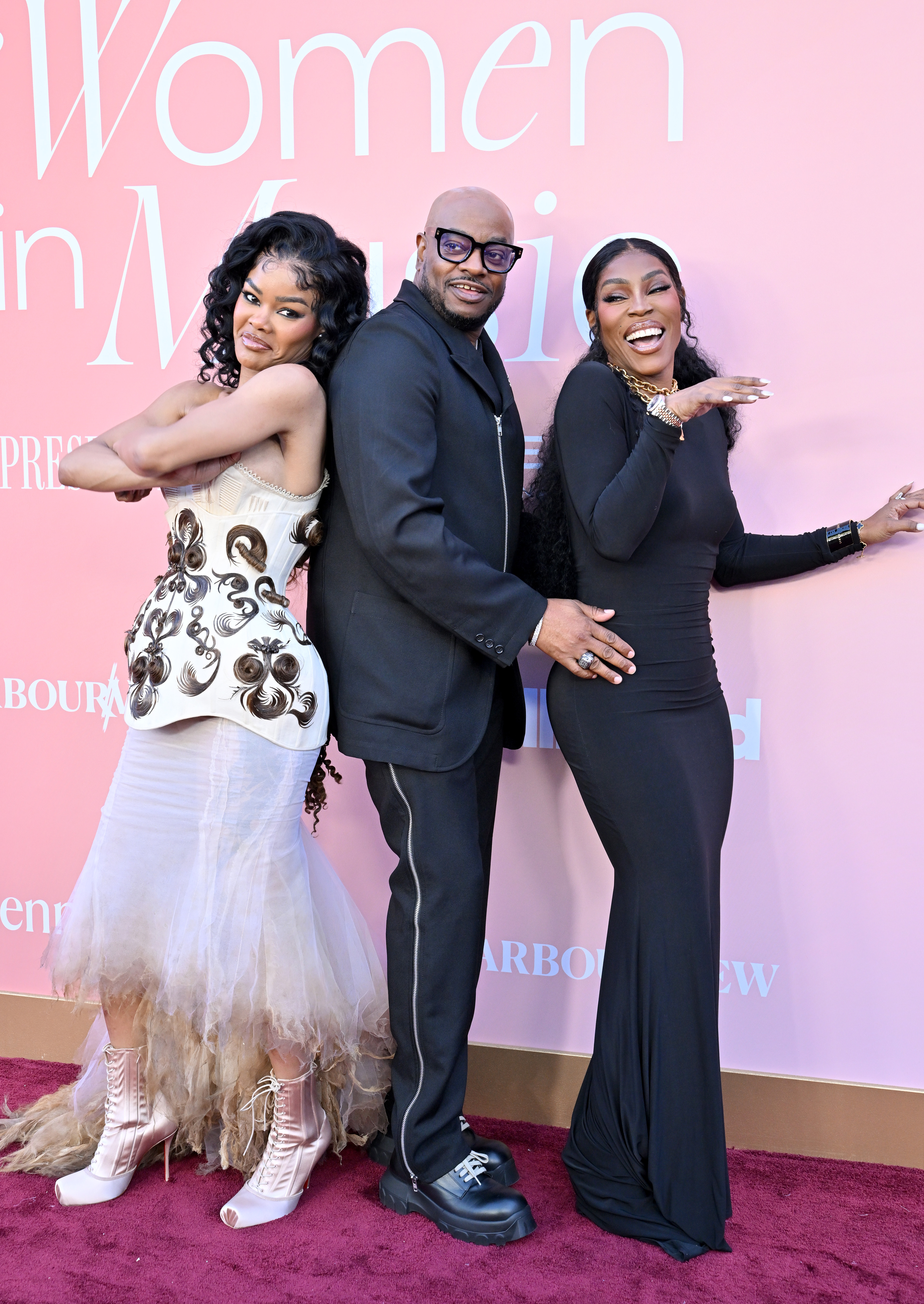 Teyana, Nikki, and Boe strike a playful pose on the red carpet | Source: Getty Images