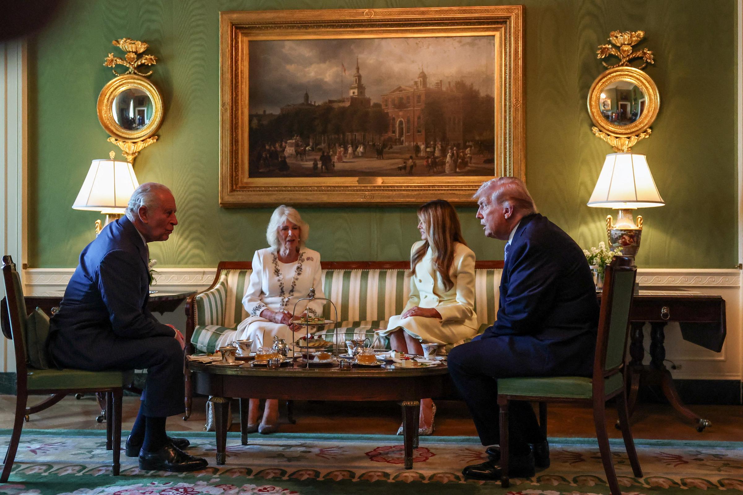 King Charles III and Queen Camilla sit with Donald and Melania Trump during a formal tea on April 27, 2026 | Source: Getty Images