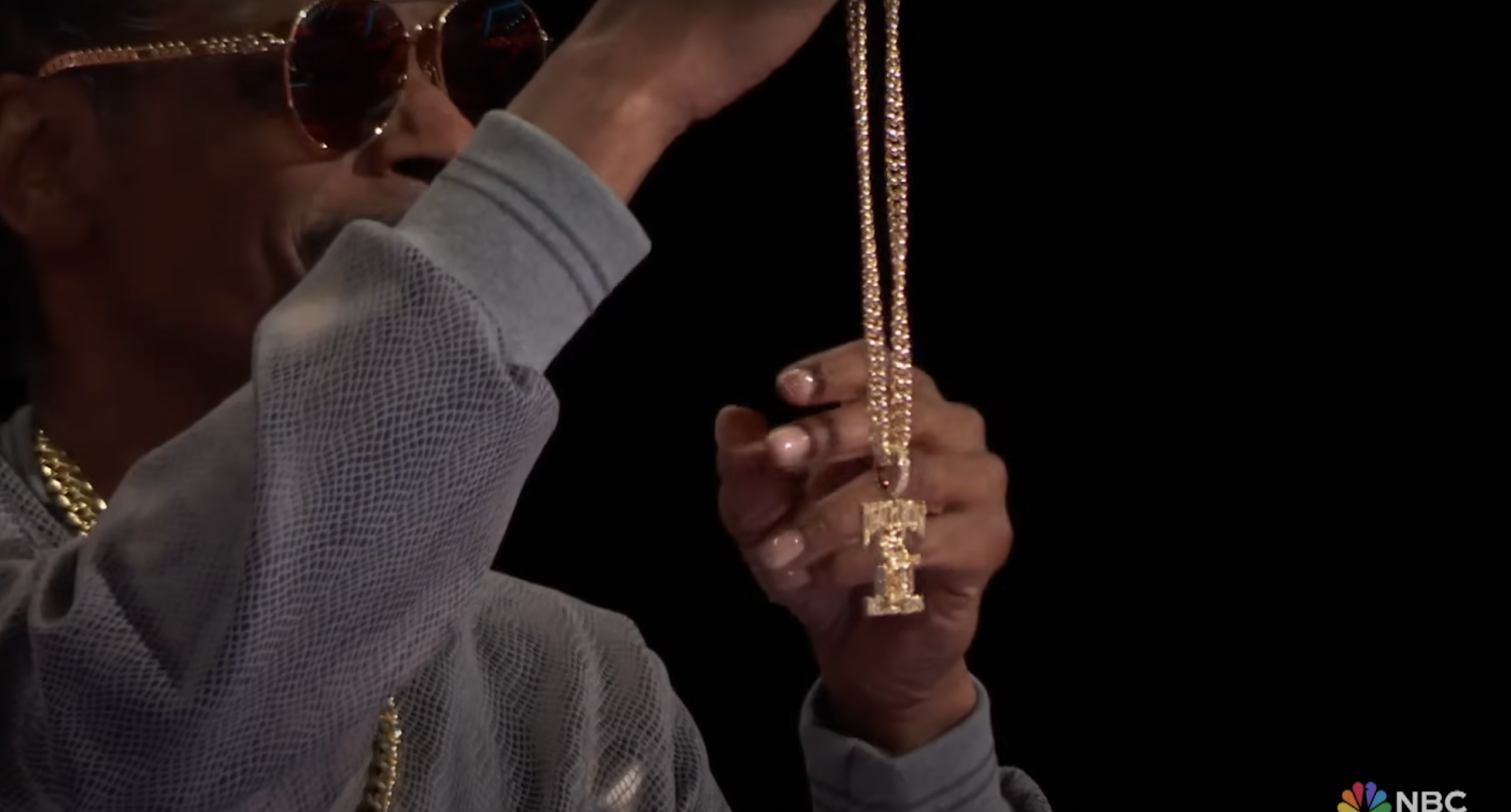 Snoop Dogg holding up the Death Row Records chain on season 26 of "The Voice." | Source: YouTube/The Voice