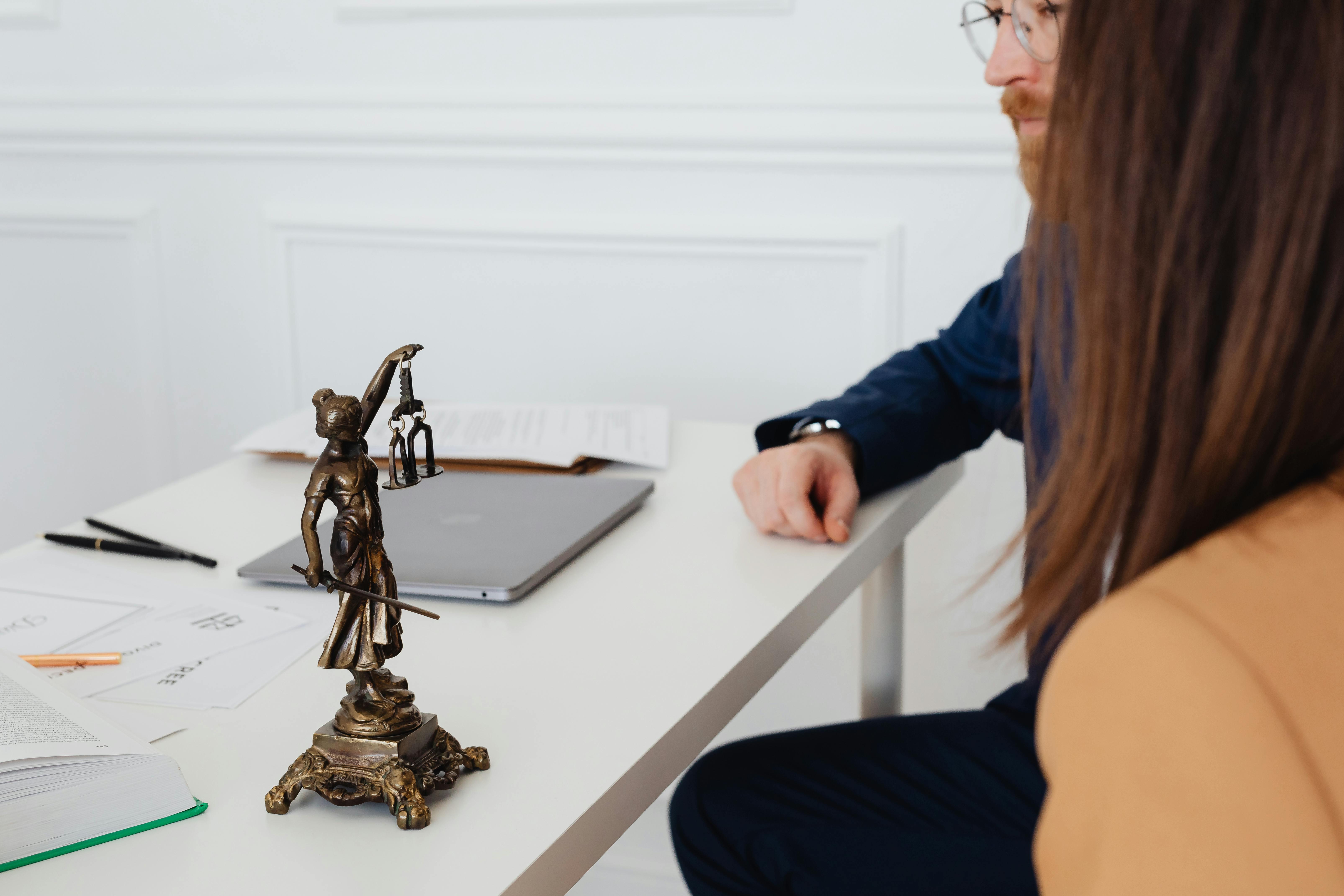People sitting in a lawyer's office | Source: Pexels