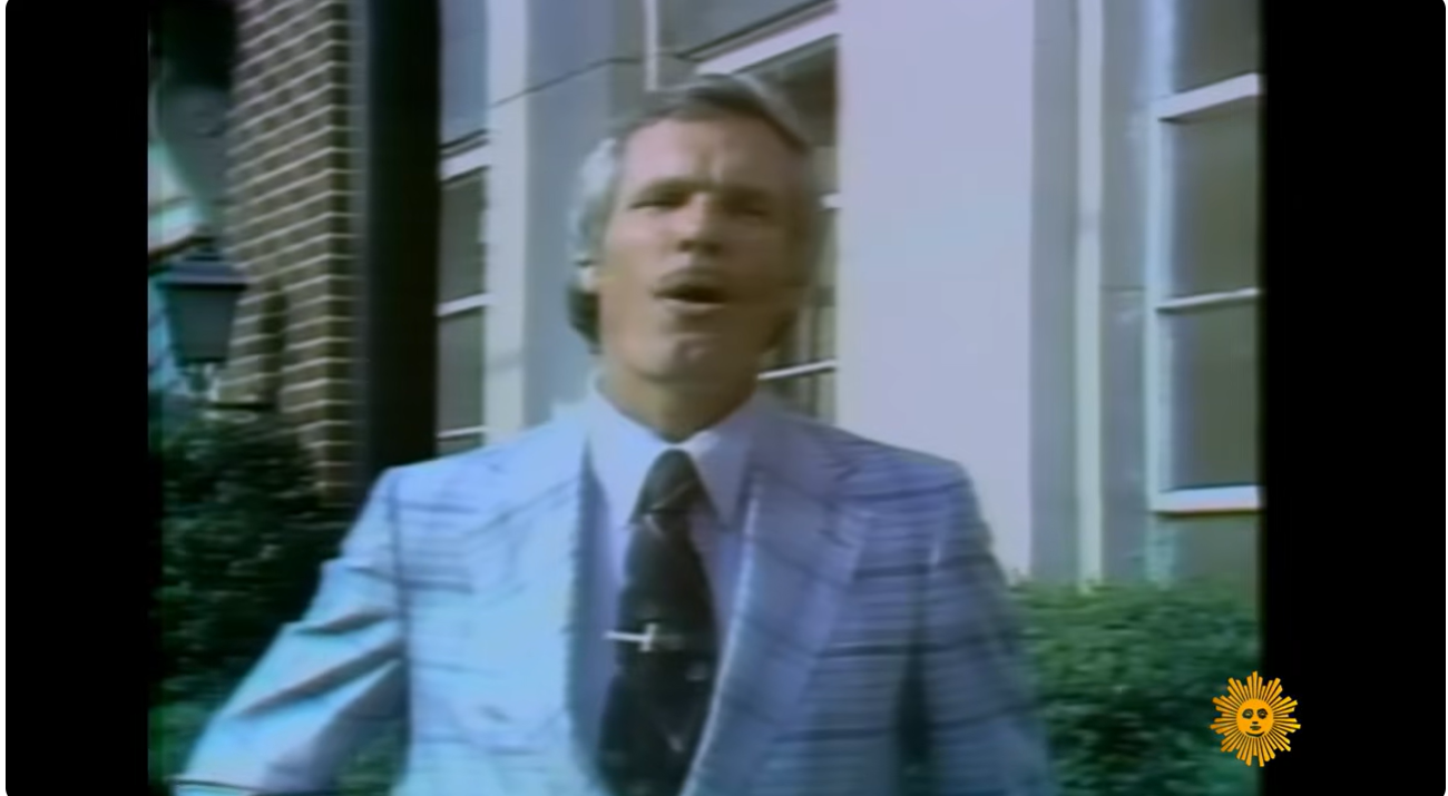 Ted Turner speaks outside a building in archival footage, capturing the outspoken media mogul during the rapid rise of his expanding broadcasting business. | Source: YouTube/CBS Sunday Morning