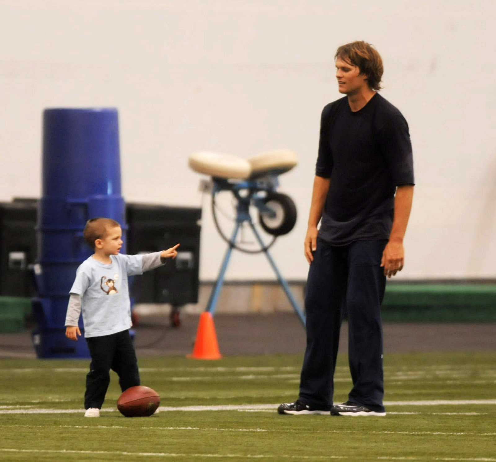 During practice in Foxboro, little Jack Moynahan is spotted on the field pointing animatedly at his dad, as though giving him coaching tips. The little boy and other family members had joined Tom Brady at the end of his practice session.