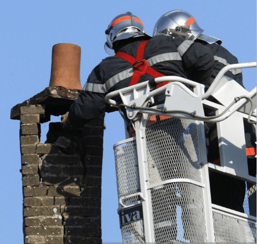 Firemen getting someone unstuck from the chimney | Source: Getty Images