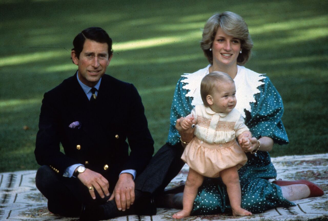 Princess Diana, Princess of Wales and Prince Charles, Prince of Wales play with their baby son Prince William. | Source: Getty Images