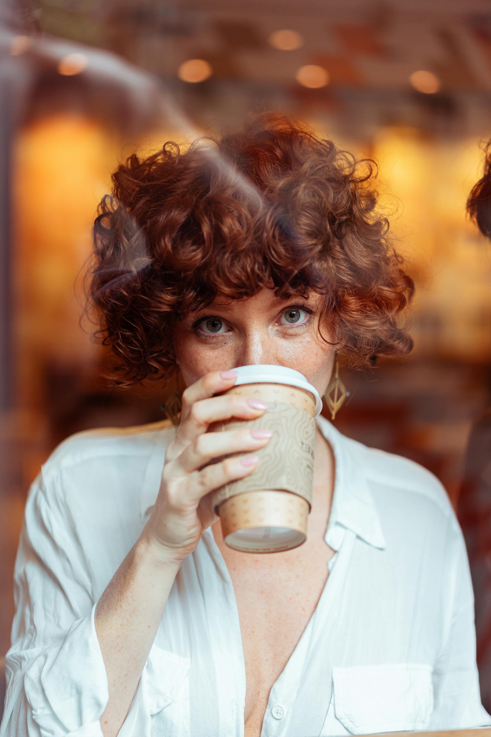 A woman drinking coffee | Source: Pexels