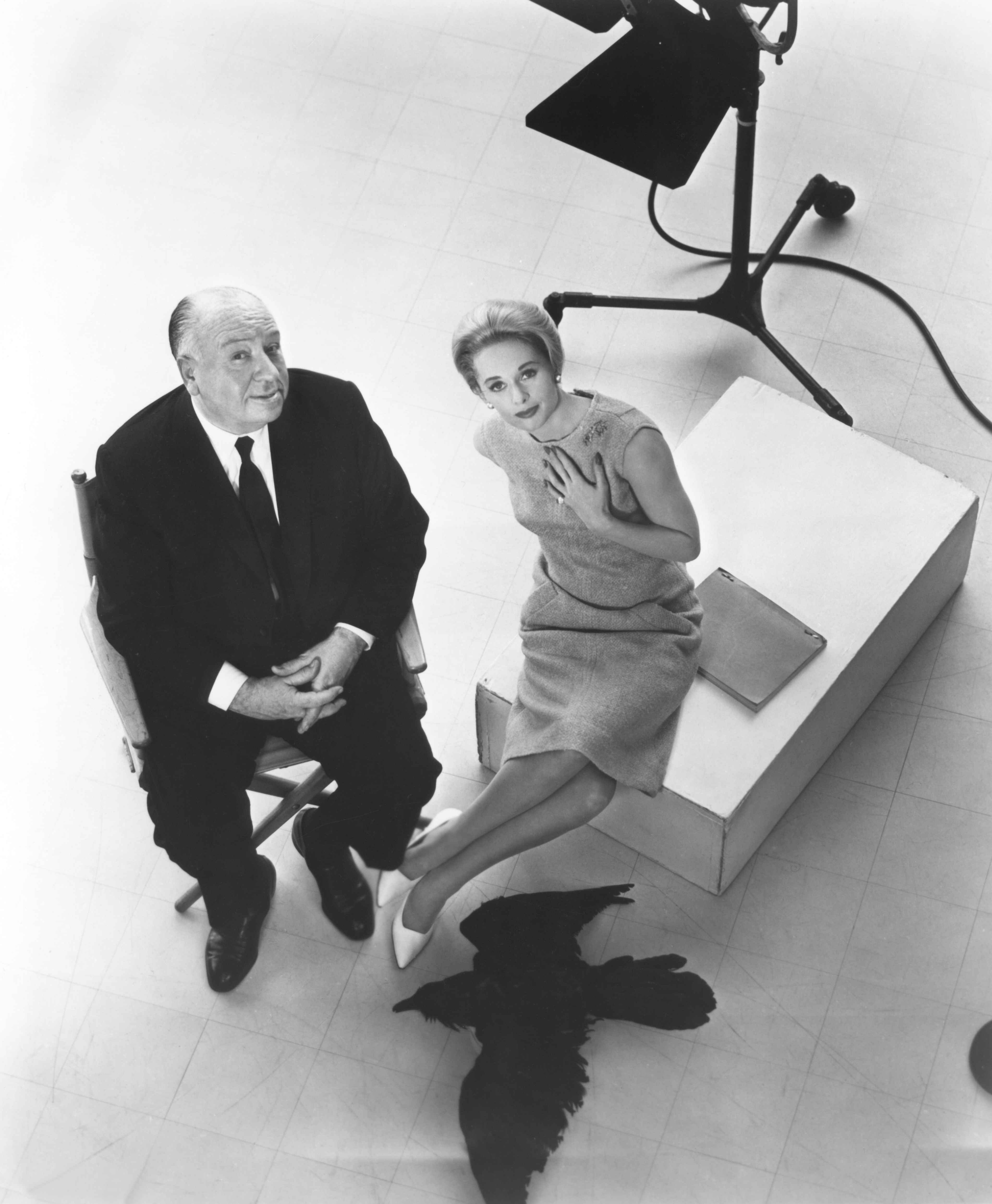 Alfred Hitchcock and Tippi Hedren on the set of "The Birds" in 1963. | Source: Getty Images