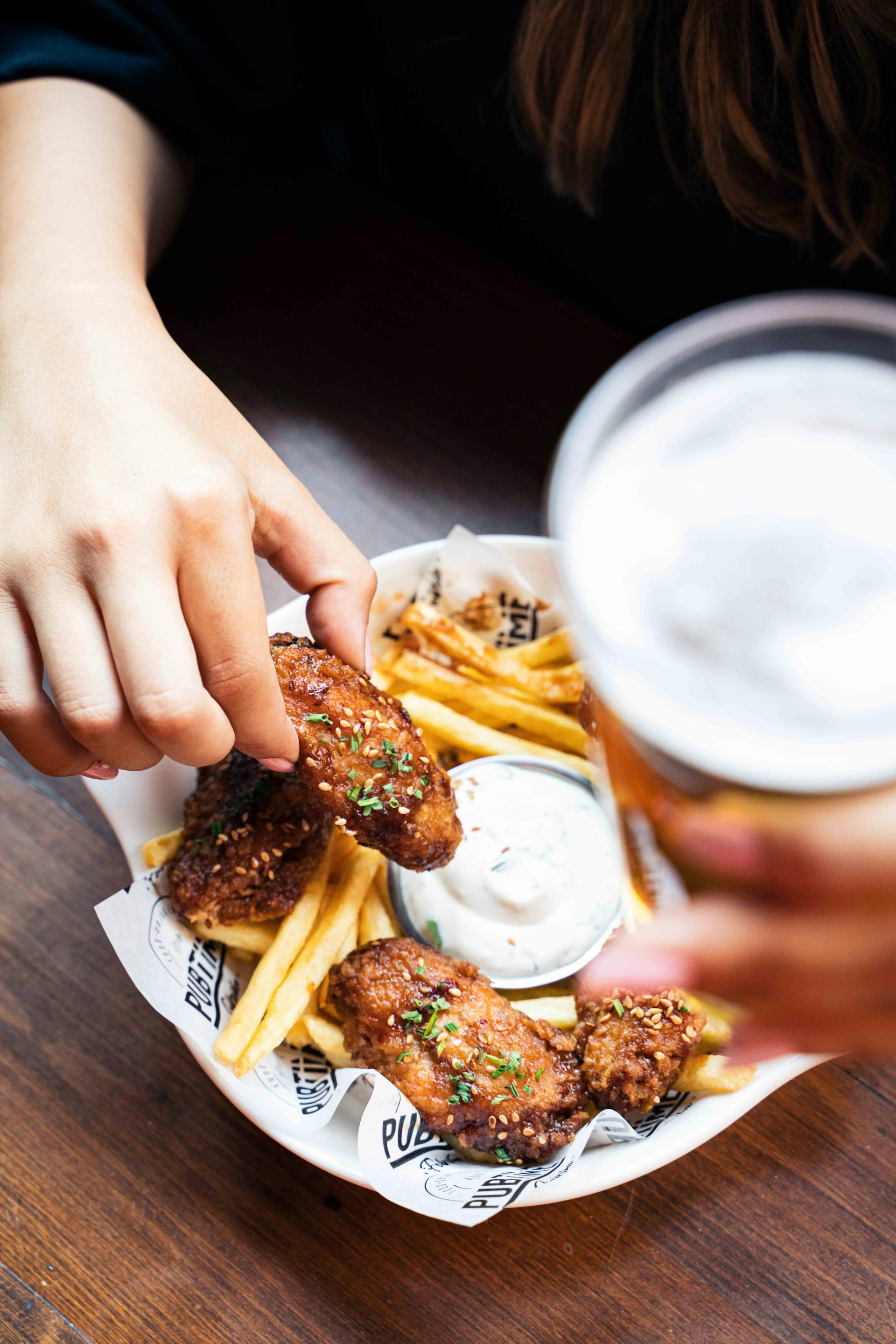 A person holding a chicken nugget | Source: Pexels