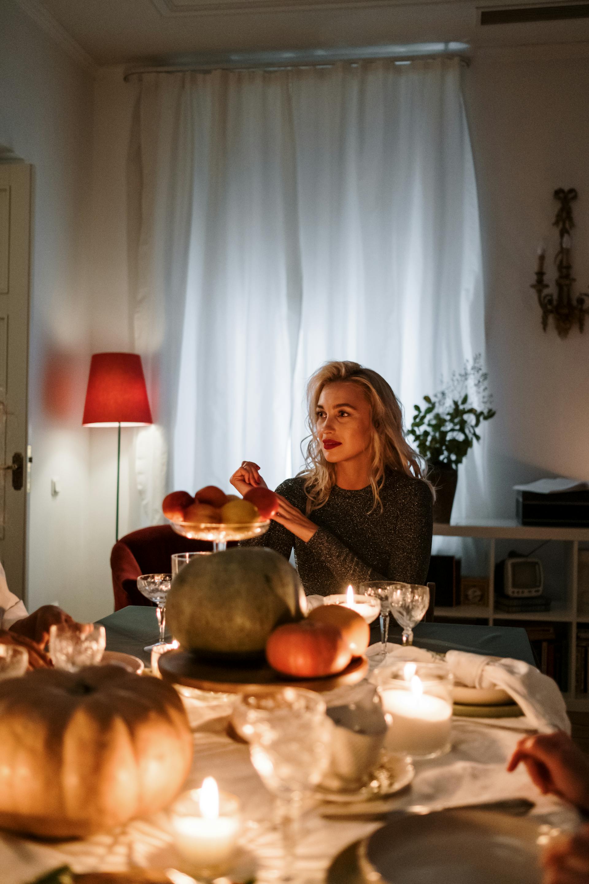 A woman sitting at the dining table | Source: Pexels