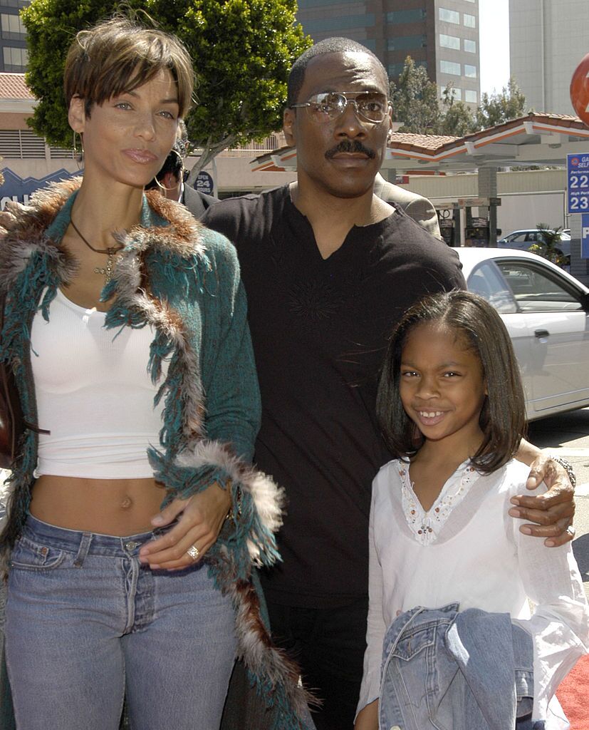 ddie Murphy with his wife Nicole Mitchell and daughter Shayne arrive at the premiere of the feature film "Daddy Day Care" on May 4, 2003 in Los Angeles, California. | Source: Getty Images