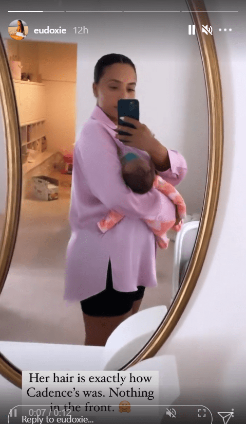 A mirror selfie of Ludacris' wife, Eudoxie Bridges cradling their son Chance | Photo:Instagram/eudoxie