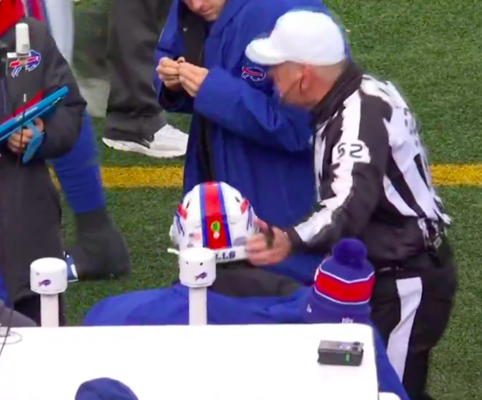 Bill Vinovich patting the side of Josh Allen's helmet. | Source: X/@NFLonCBS