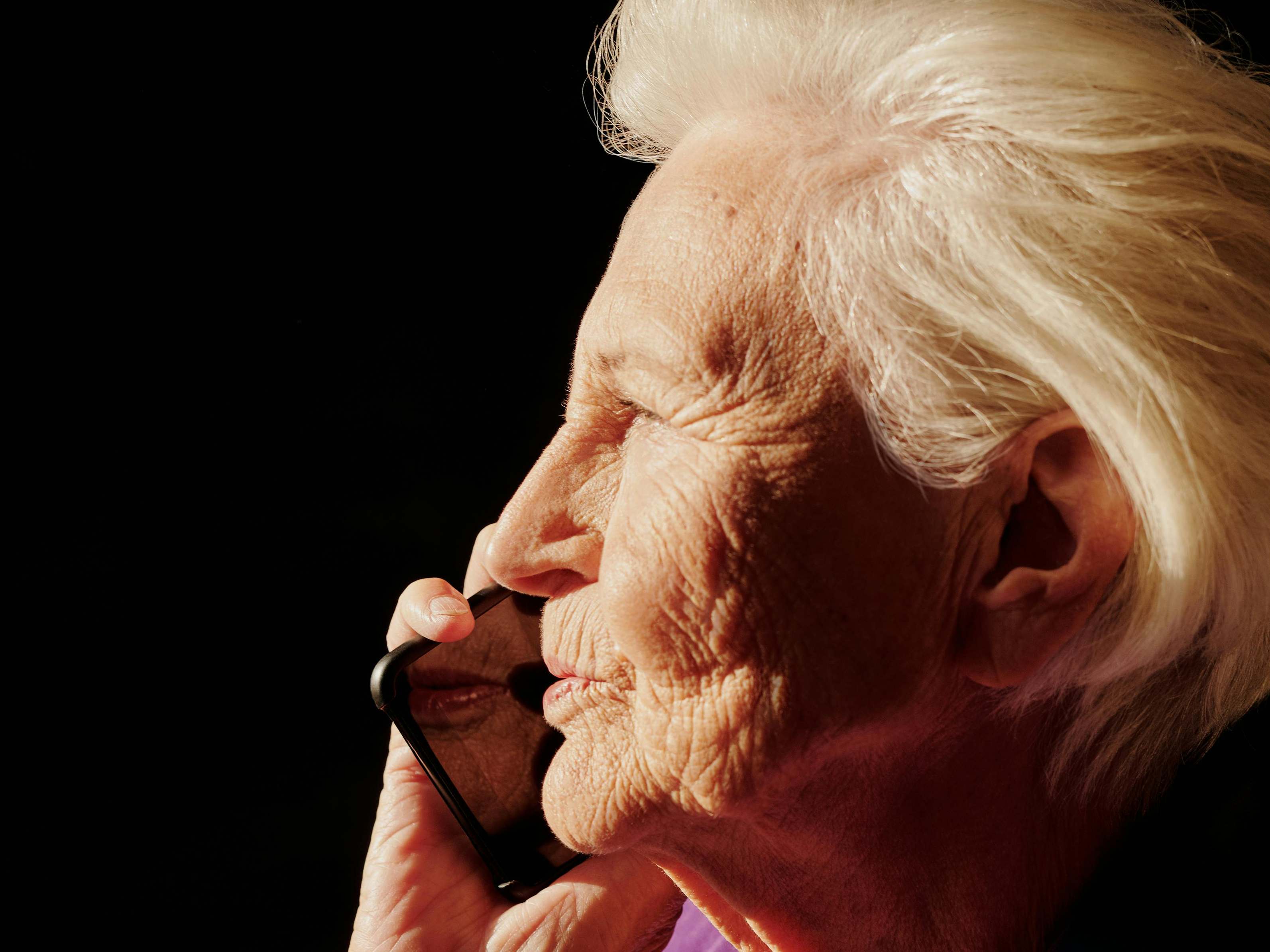 Another angle of a serious-looking woman talking on a mobile phone | Source: Pexels