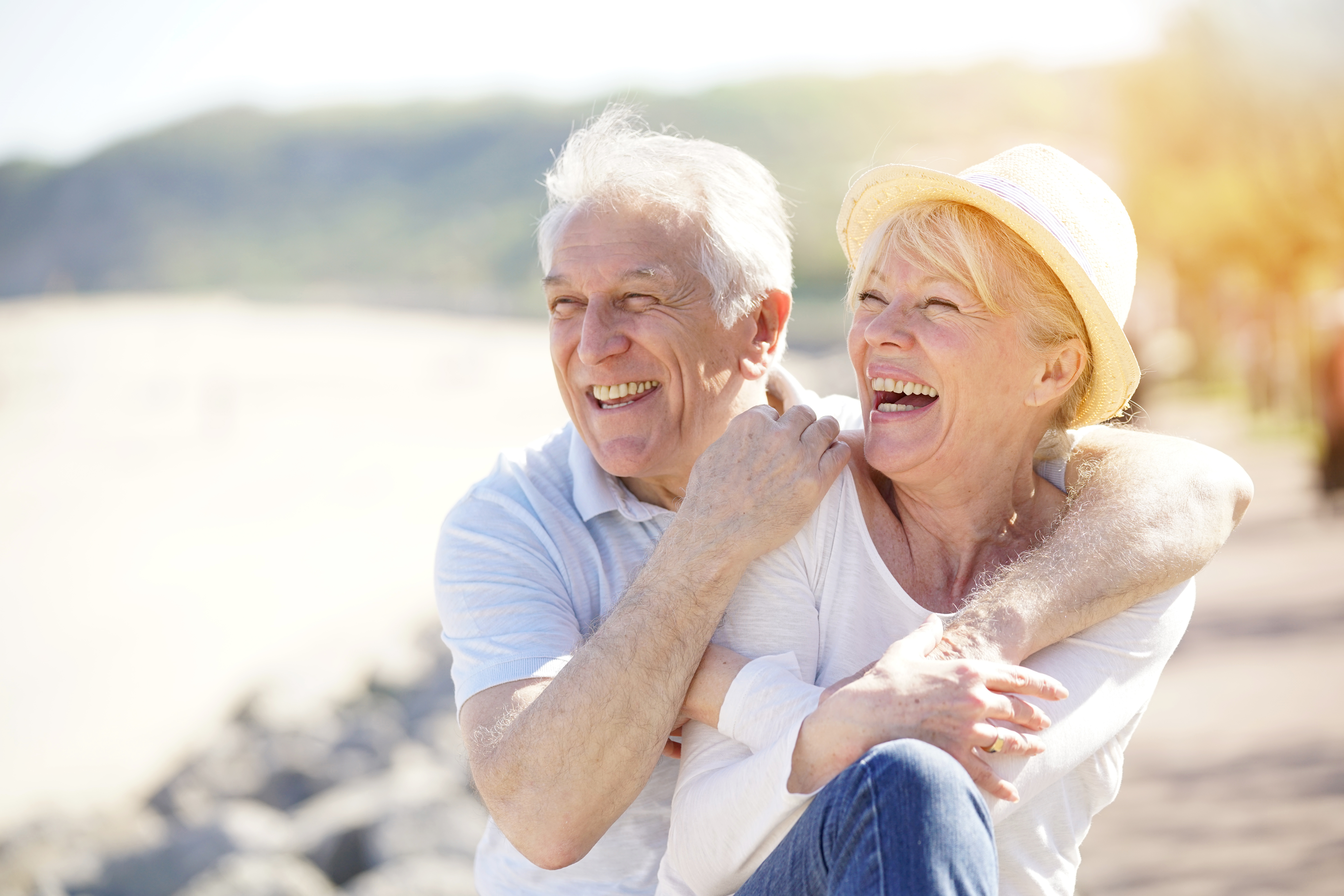 A senior couple relaxing by the sea on a sunny day | Source: Shutterstock