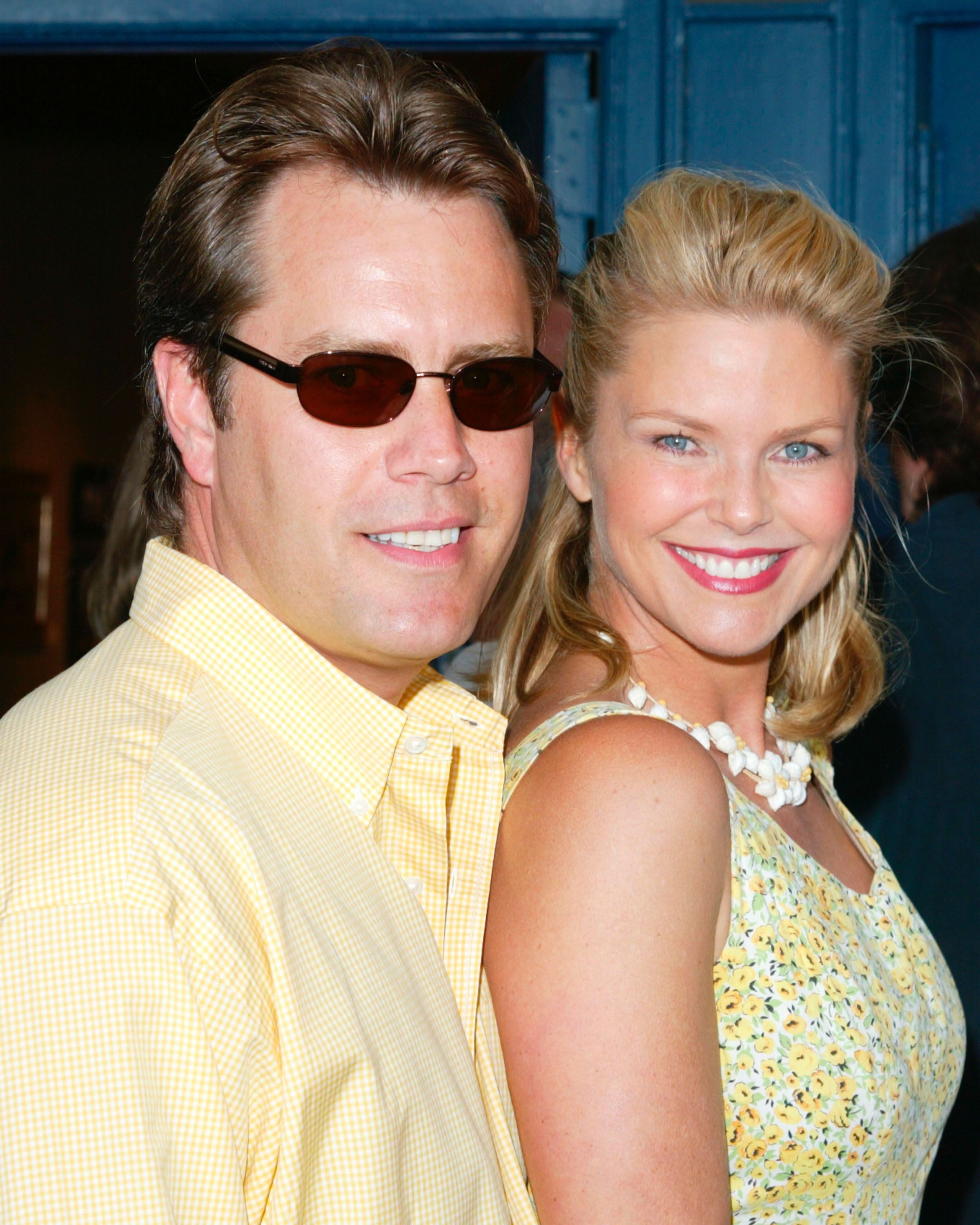 Christie Brinkley (R) and Peter Cook (L) arrive for the premiere of "The Hamptons" June 1, 2002 in Sag Harbor, NY. | Source: Getty Images