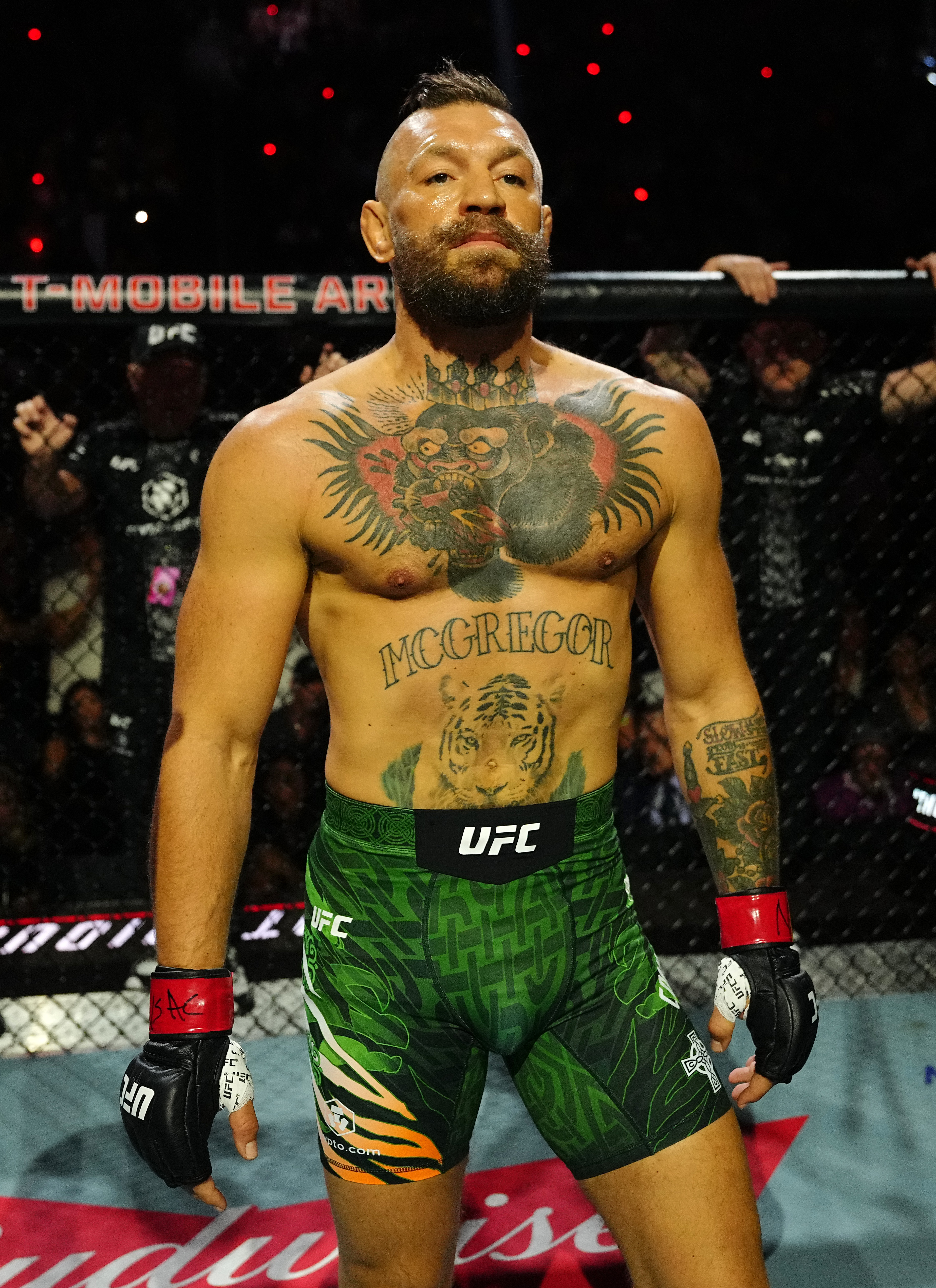 Conor McGregor stands inside the Octagon before his welterweight bout against Max Holloway at UFC 329 at T-Mobile Arena in Las Vegas on July 11, 2026. Years after his dramatic featherweight weight cuts, the Irish fighter looked considerably bigger and more muscular at 170 pounds, underscoring one of the most striking physical transformations of his UFC career.