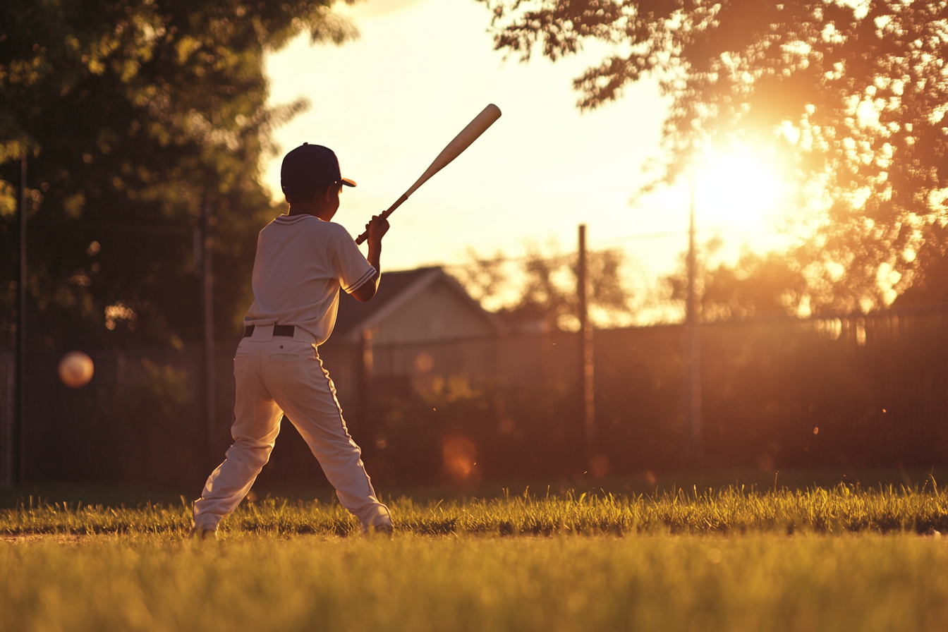 A boy holding a baseball bat | Source: Midjourney