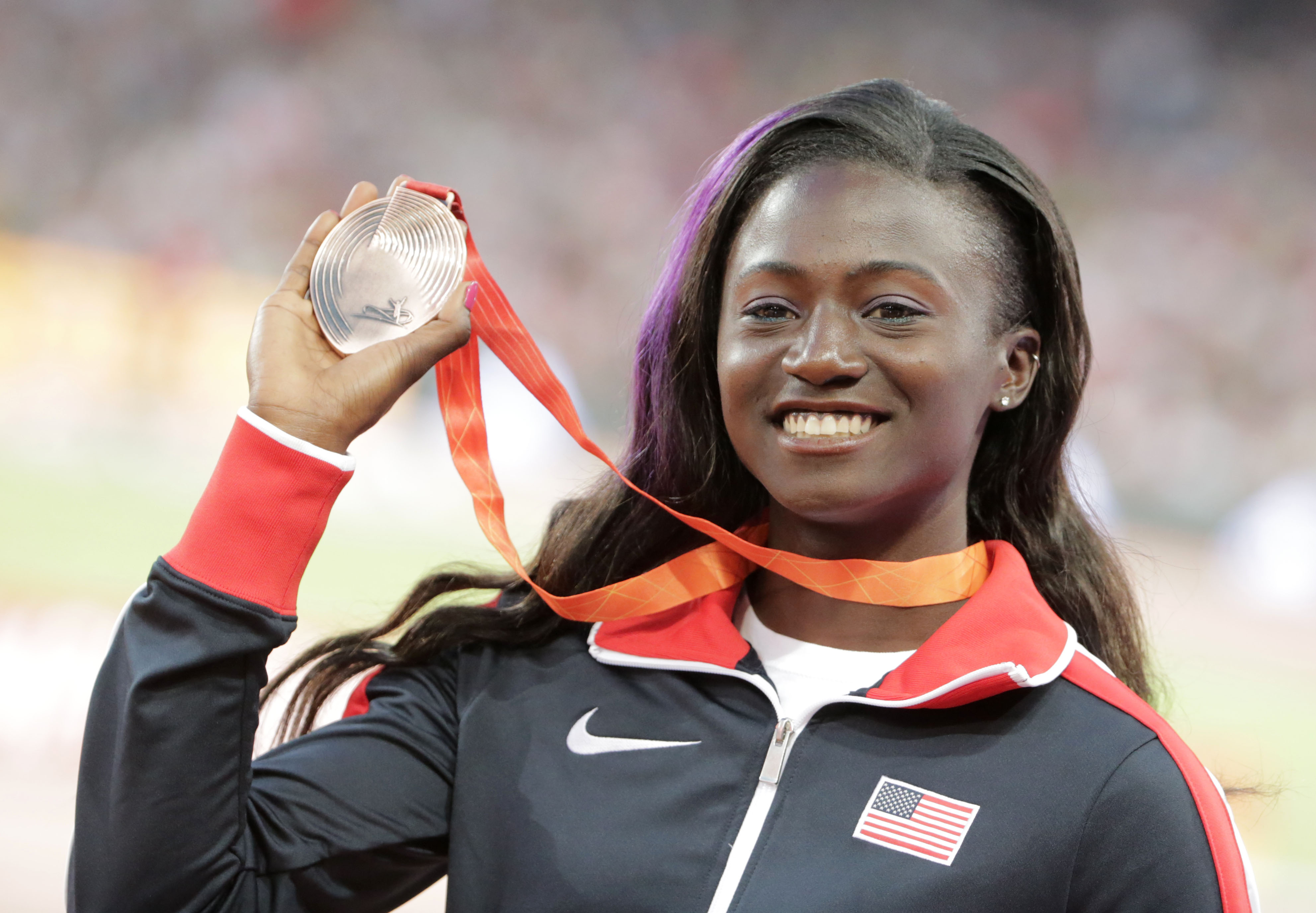 Tori Bowie of USA poses with her bronze medal on the podium during the medal ceremony of the women's 100m final during the Beijing 2015 IAAF World Championships at the National Stadium, also known as Bird's Nest, in Beijing, China, 25 August 2015. | Source: Getty Images