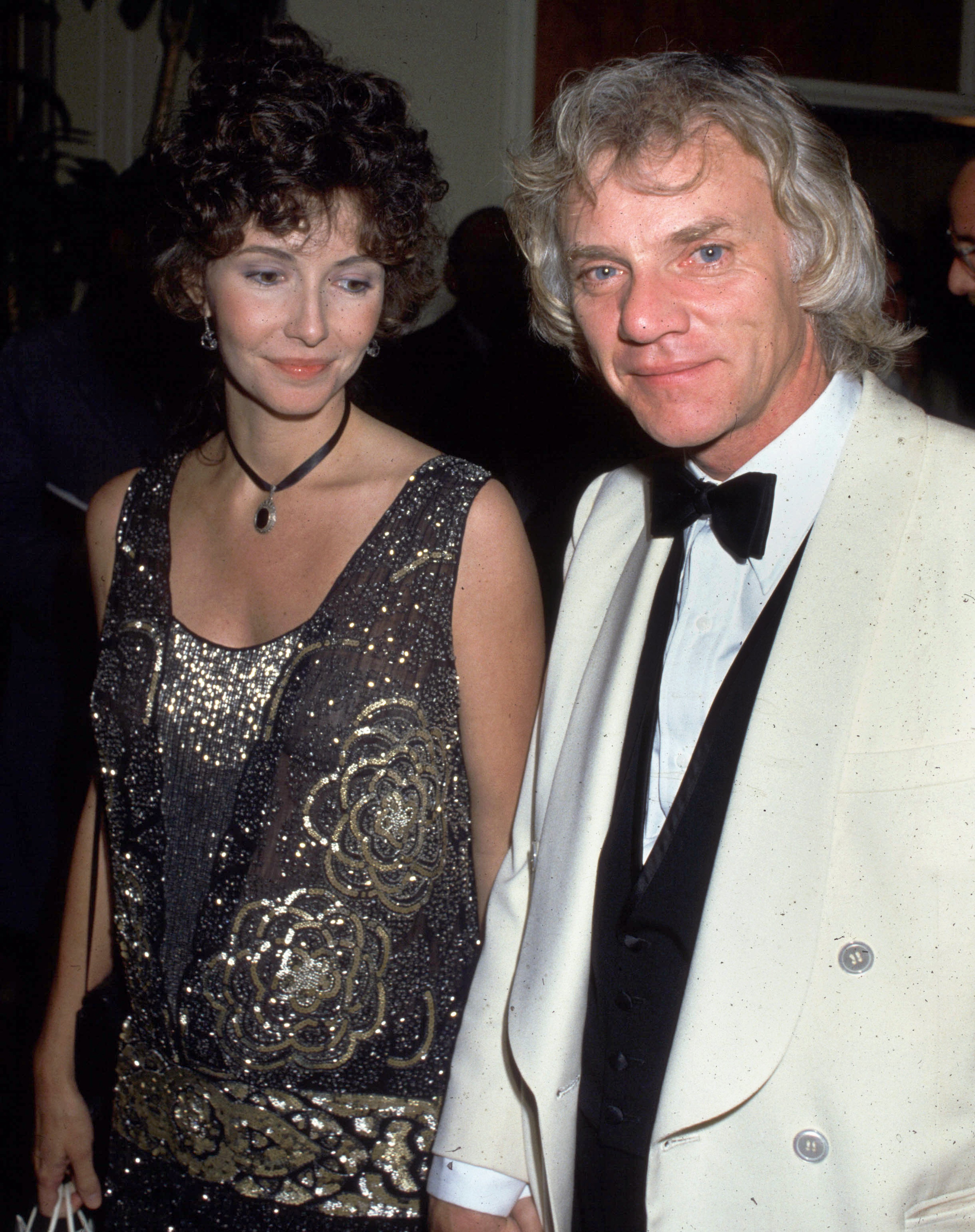 English actor Malcolm McDowell with his wife, Mary Steenburgen, at the premiere party for 'Blue Thunder' at the Beverly Hilton Hotel in Beverly Hills, California, United States. | Source: Getty Images